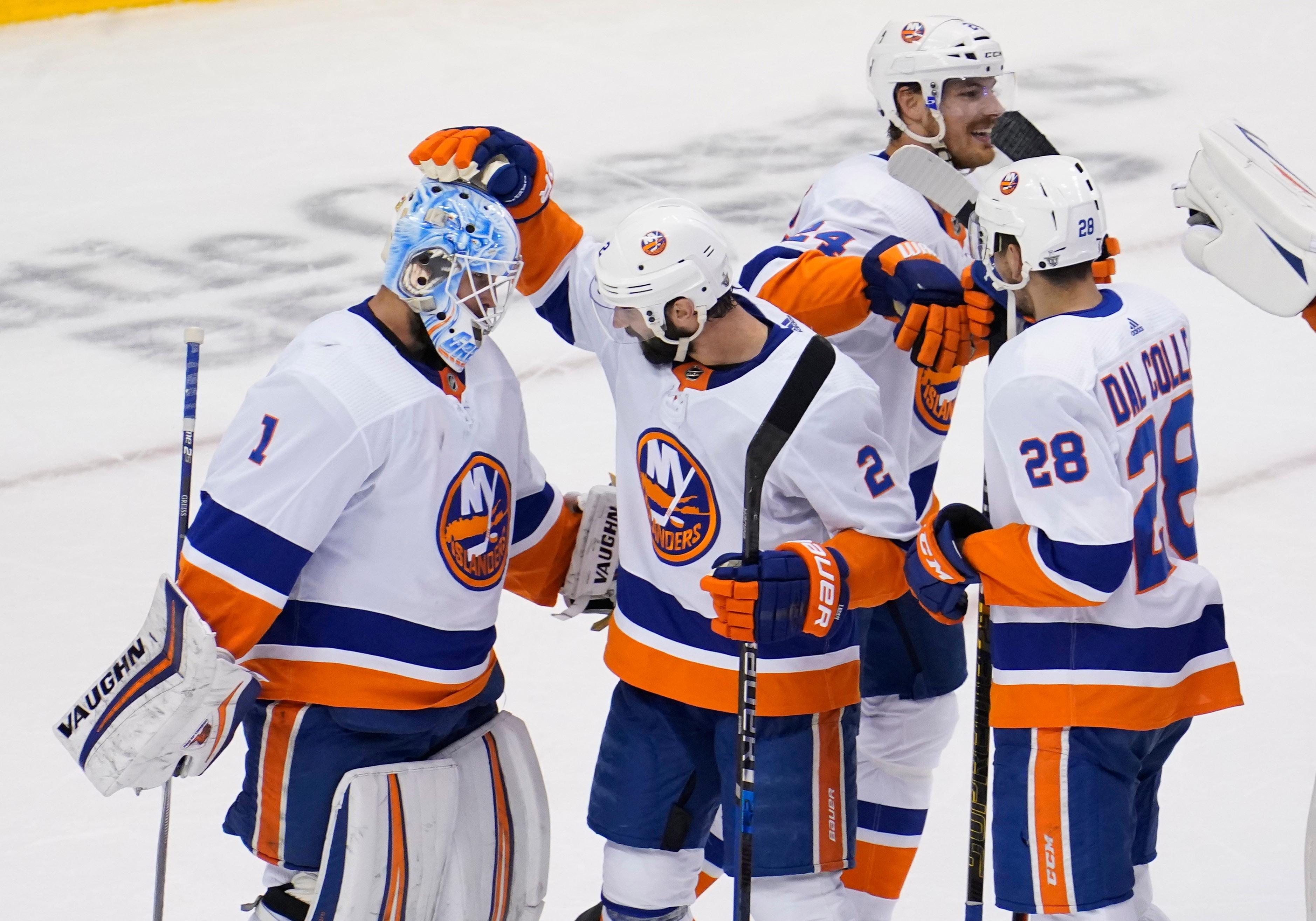 Sep 5, 2020; Toronto, Ontario, CAN; New York Islanders goaltender Thomas Greiss (1) celebrates with teammates including Nick Leddy (2) after defeating the Philadelphia Flyers in game seven of the second round of the 2020 Stanley Cup Playoffs at Scotiabank Arena. Mandatory Credit: John E. Sokolowski-USA TODAY Sports / John E. Sokolowski-USA TODAY Sports