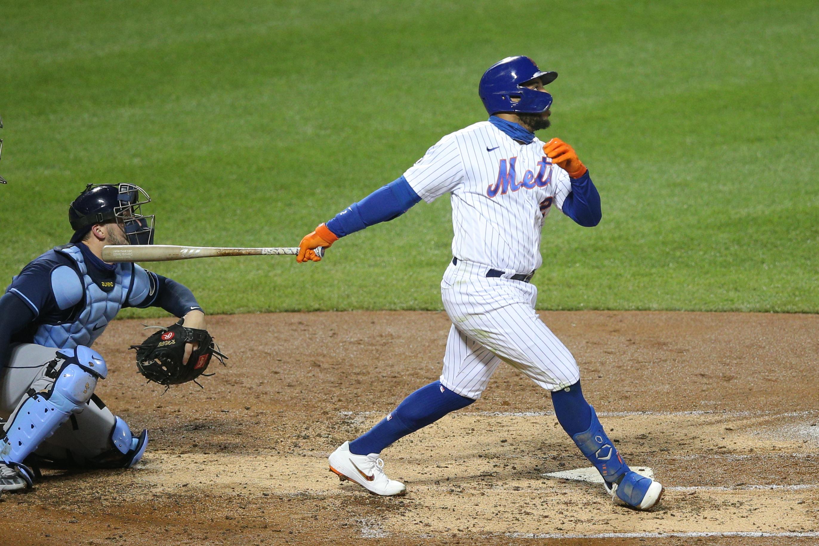 Sep 23, 2020; New York City, New York, USA; New York Mets left fielder Dominic Smith (2) follows through on a solo home run against the Tampa Bay Rays during the fourth inning at Citi Field. Mandatory Credit: Brad Penner-USA TODAY Sports / © Brad Penner-USA TODAY Sports