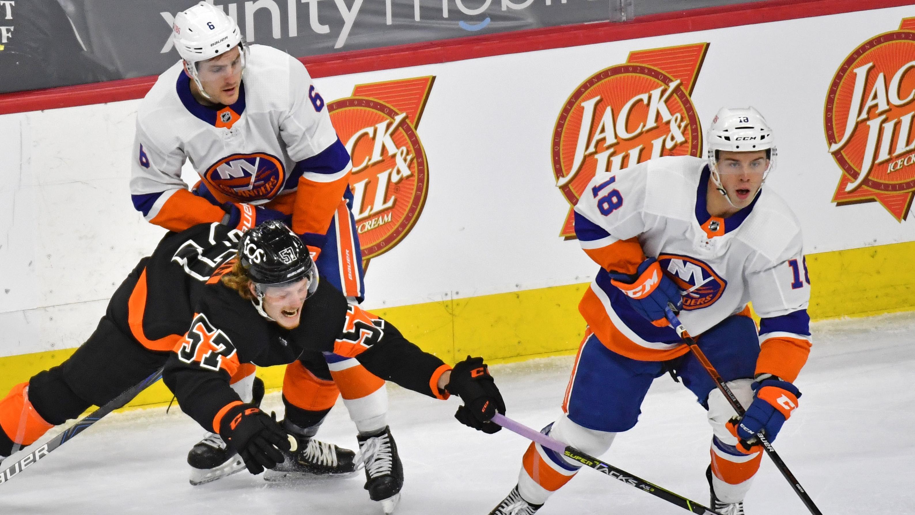 Apr 18, 2021; Philadelphia, Pennsylvania, USA; New York Islanders left wing Anthony Beauvillier (18) skates away with the puck from Philadelphia Flyers right wing Wade Allison (57) during the second period at Wells Fargo Center. / © Eric Hartline-USA TODAY Sports