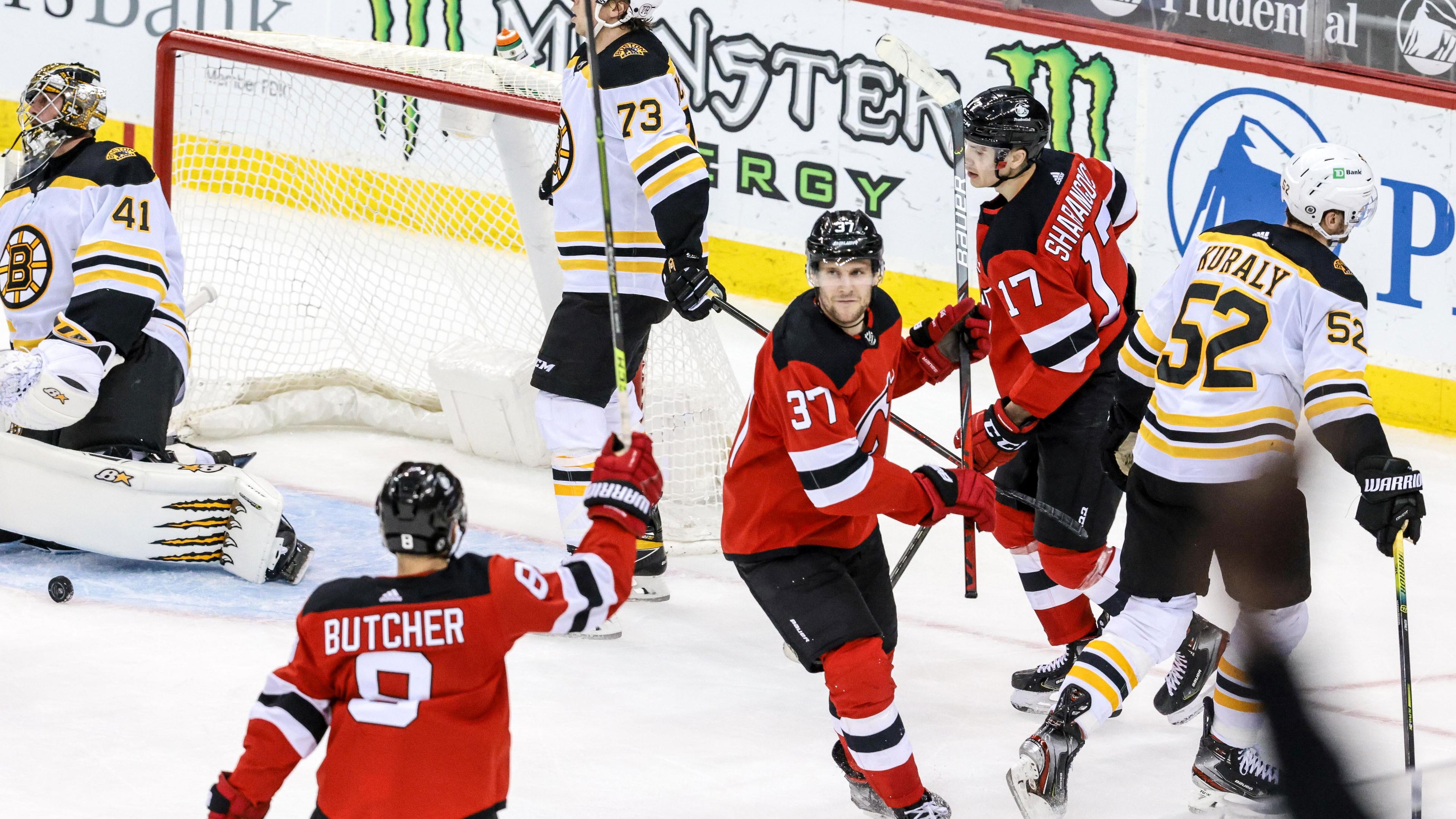 May 4, 2021; Newark, New Jersey, USA; New Jersey Devils center Pavel Zacha (37) celebrates with defenseman Will Butcher (8) and center Yegor Sharangovich (17) after scoring the game winning goal past Boston Bruins goaltender Jaroslav Halak (41) in overtime at Prudential Center. / Vincent Carchietta-USA TODAY Sports