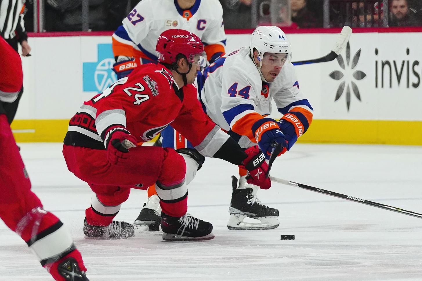New York Islanders center Jean-Gabriel Pageau (44) and Carolina Hurricanes center Seth Jarvis (24) battle over the puck during the second period in game two of the first round of the 2023 Stanley Cup Playoffs at PNC Arena. / James Guillory-USA TODAY Sports