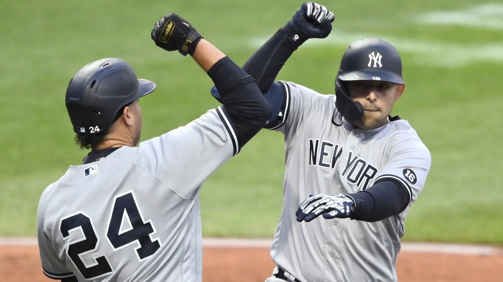 Apr 23, 2021; Cleveland, Ohio, USA; New York Yankees second baseman Rougned Odor (R) celebrates his two-run home run with catcher Gary Sanchez (24) during the second inning against the Cleveland Indians at Progressive Field. / David Richard-USA TODAY Sports