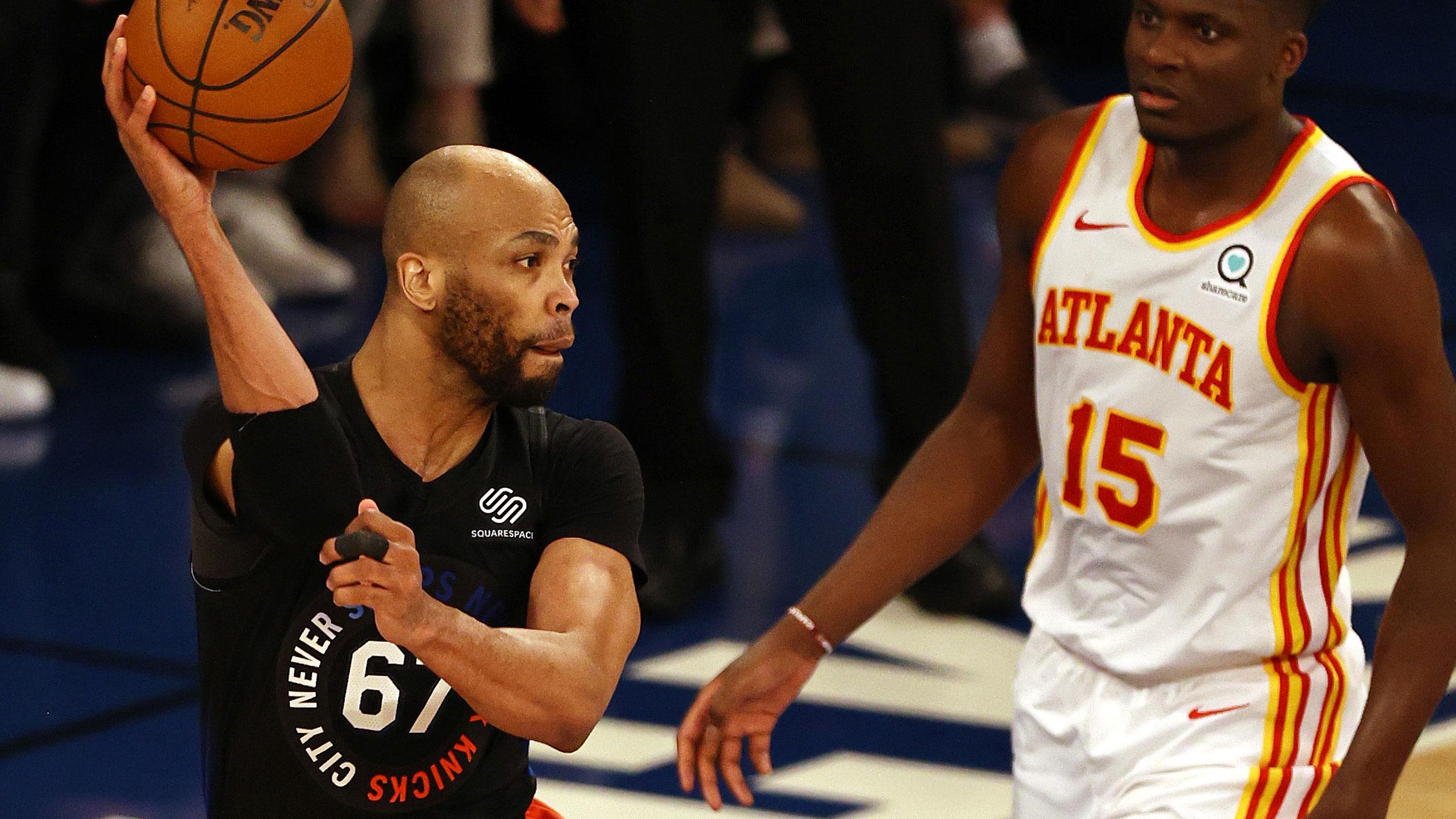 May 26, 2021; New York, New York, USA; New York Knicks center Taj Gibson (67) passes the ball in front of Atlanta Hawks center Clint Capela (15) during the second half of game two of the Eastern Conference quarterfinal at Madison Square Garden. / Elsa/POOL PHOTOS-USA TODAY Sports