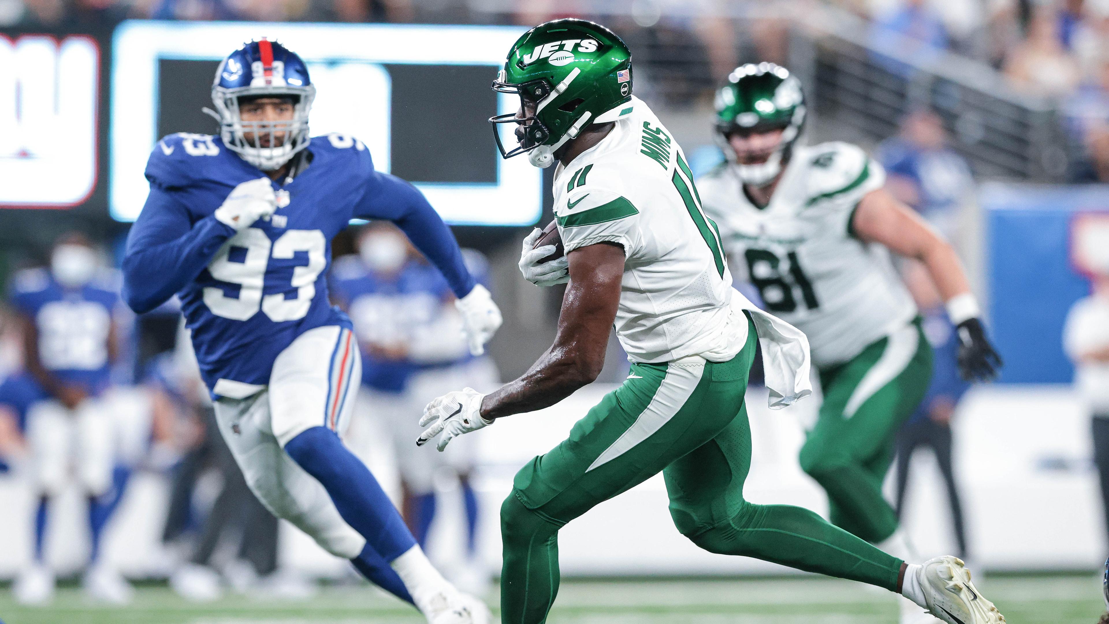 New York Jets wide receiver Denzel Mims (11) gains yards after a catch against New York Giants linebacker Trent Harris (93) during the second half at MetLife Stadium. / Vincent Carchietta-USA TODAY Sports