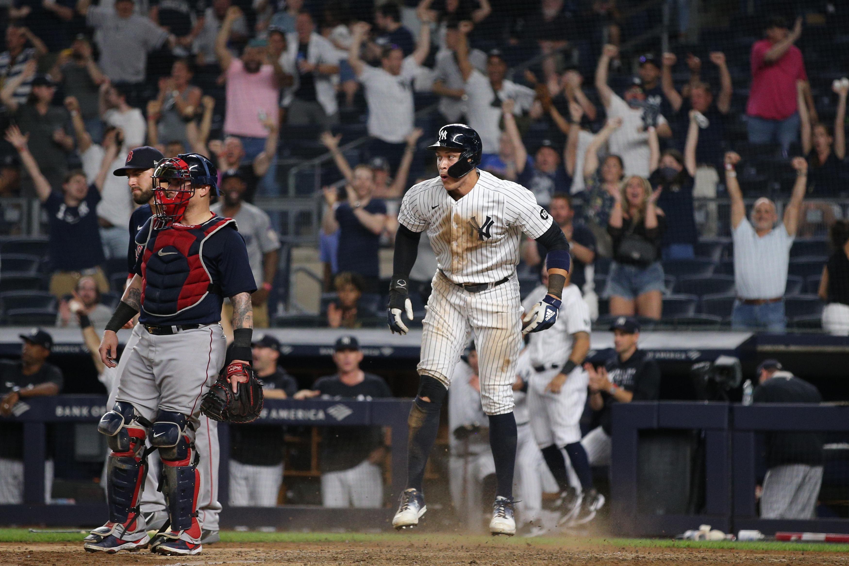Jun 6, 2021; Bronx, New York, USA; New York Yankees designated hitter Aaron Judge (99) reacts after scoring a run against the Boston Red Sox on a double by Yankees shortstop Gleyber Torres (not pictured) during the ninth inning at Yankee Stadium. / © Brad Penner-USA TODAY Sports