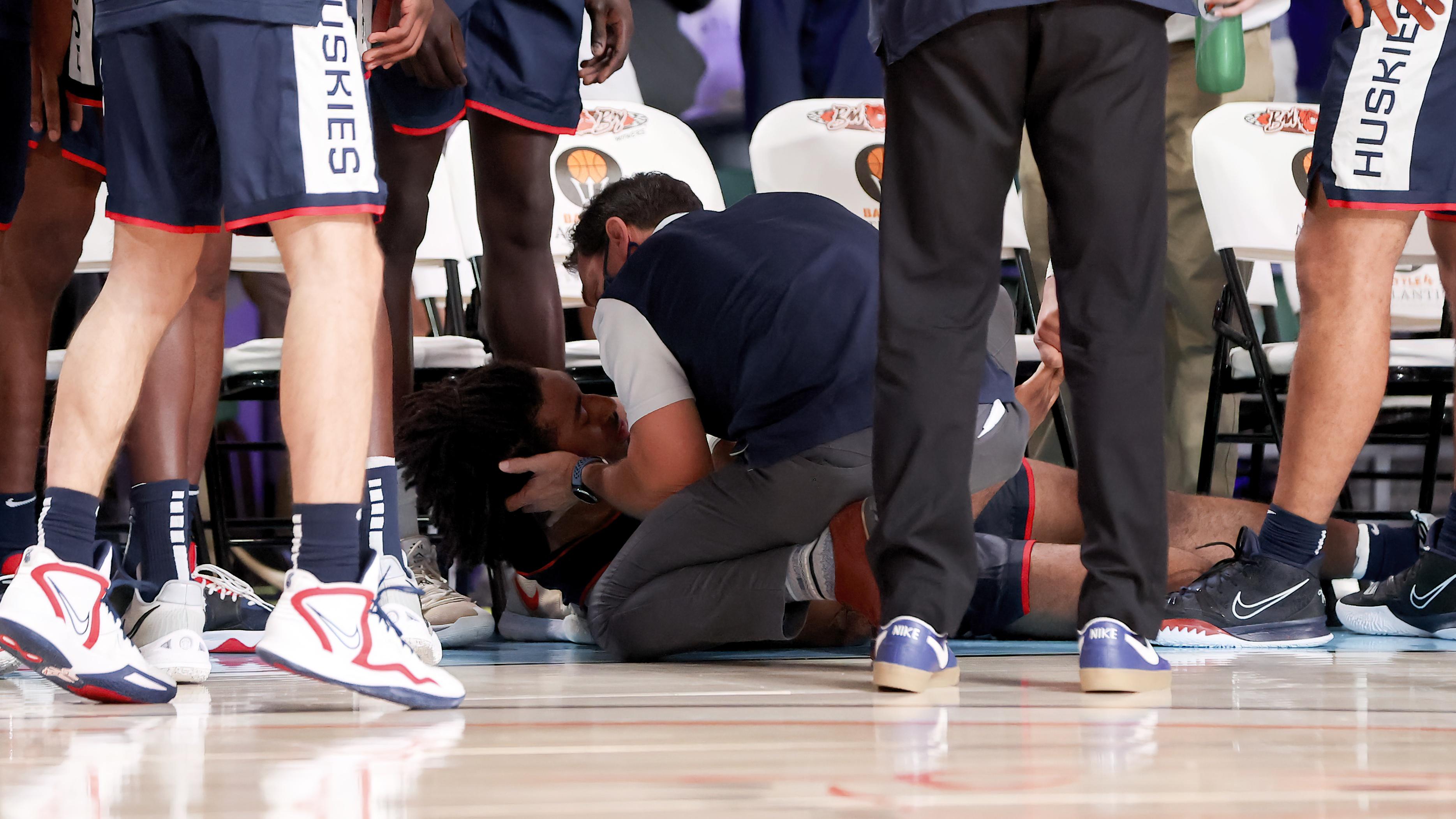 Nov 24, 2021; Nassau, BHS; Connecticut Huskies forward Isaiah Whaley (5) receives medical attention after the game against the Auburn Tigers in the 2021 Battle 4 Atlantis at Imperial Arena. Mandatory Credit: Kevin Jairaj-USA TODAY Sports / © Kevin Jairaj-USA TODAY Sports