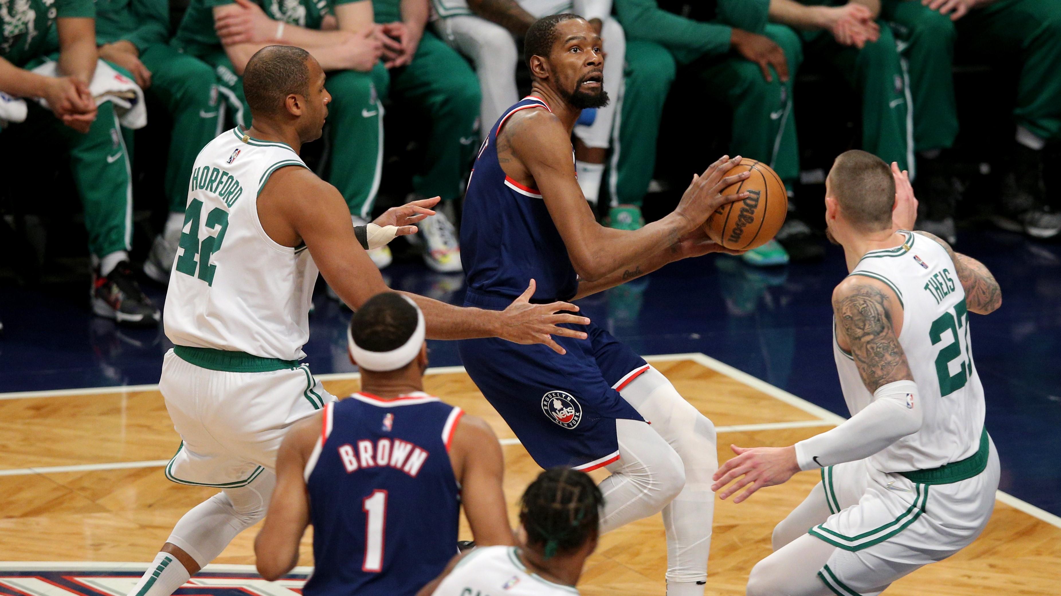 Apr 25, 2022; Brooklyn, New York, USA; Brooklyn Nets forward Kevin Durant (7) drives to the basket against Boston Celtics center Al Horford (42) and center Daniel Theis (27) during the first quarter of game four of the first round of the 2022 NBA playoffs at Barclays Center. / Brad Penner-USA TODAY Sports