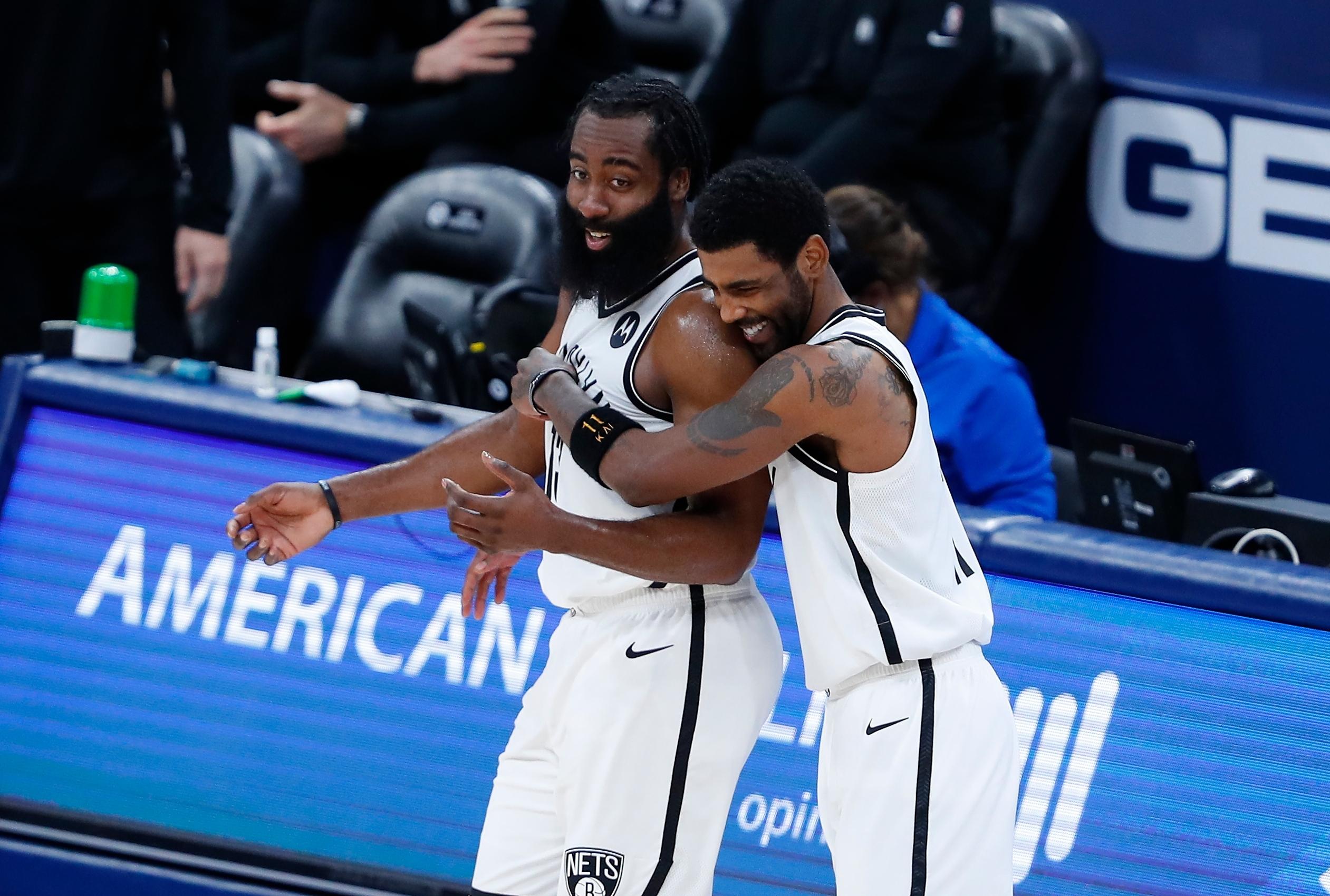 Jan 29, 2021; Oklahoma City, Oklahoma, USA; Brooklyn Nets guard James Harden (left) and guard Kyrie Irving (right) celebrate during a time out against the Oklahoma City Thunder during the second half at Chesapeake Energy Arena. Mandatory Credit: Alonzo Adams-USA TODAY Sports / Alonzo Adams-USA TODAY Sports