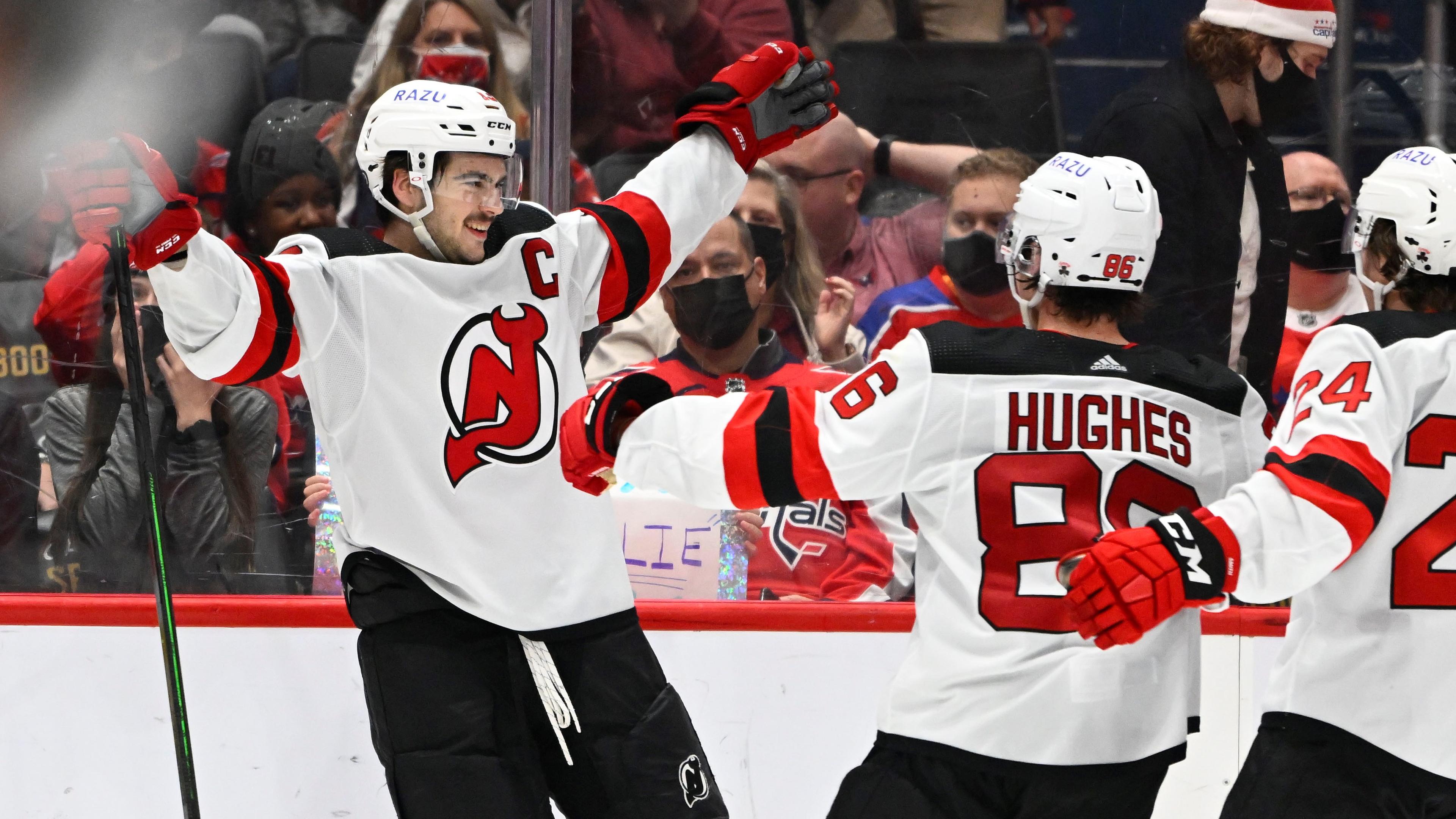 Jan 2, 2022; Washington, District of Columbia, USA; New Jersey Devils center Nico Hischier (13) reacts after scoring the game winning goal against the Washington Capitals during the overtime period at Capital One Arena. Mandatory Credit: Brad Mills-USA TODAY Sports / Brad Mills-USA TODAY Sports