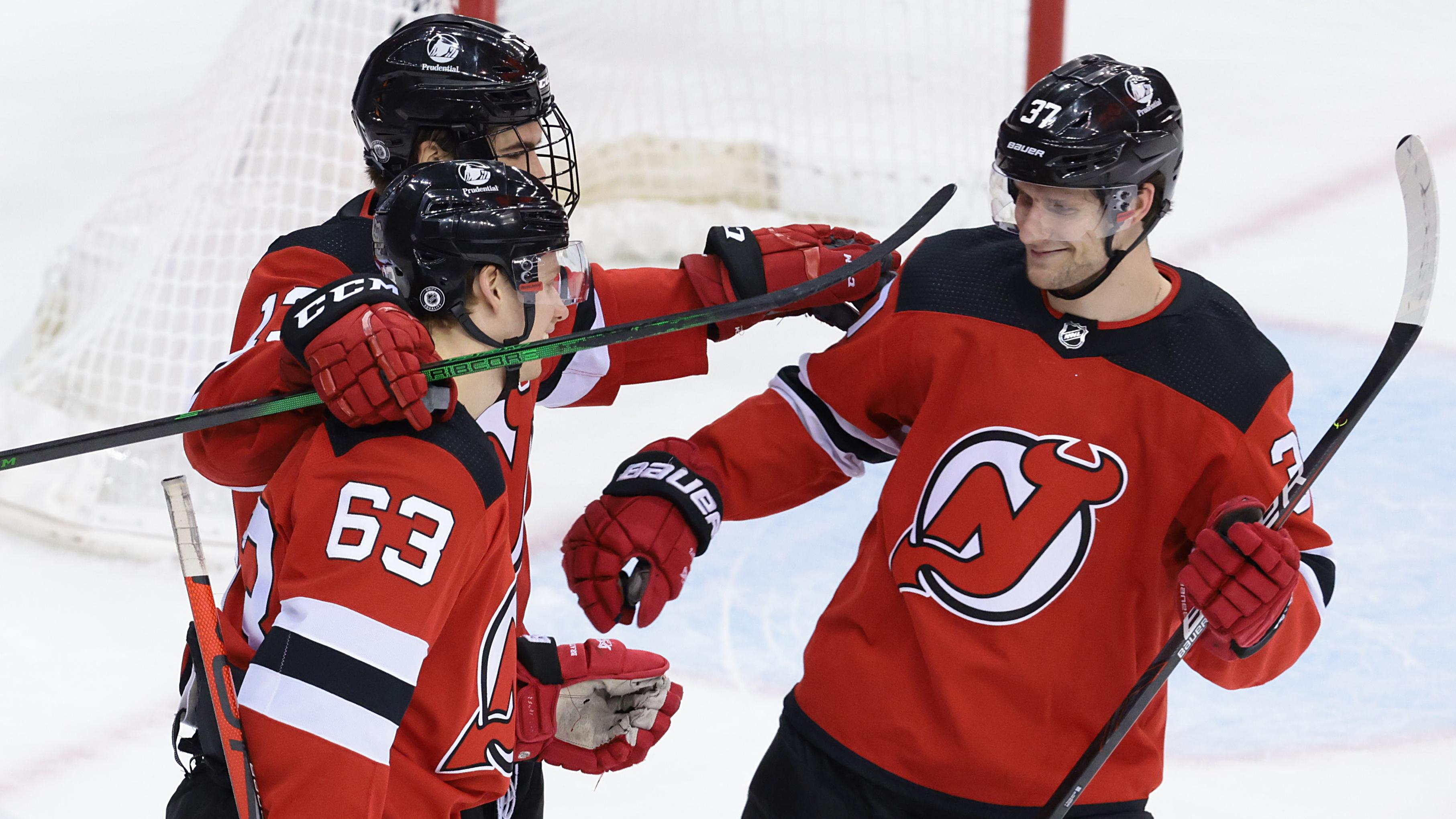 Apr 29, 2021; Newark, New Jersey, USA; New Jersey Devils center Pavel Zacha (37) celebrates his goal with left wing Jesper Bratt (63) and center Nico Hischier (13) during the third period against the Philadelphia Flyersat Prudential Center. / © Vincent Carchietta-USA TODAY Sports