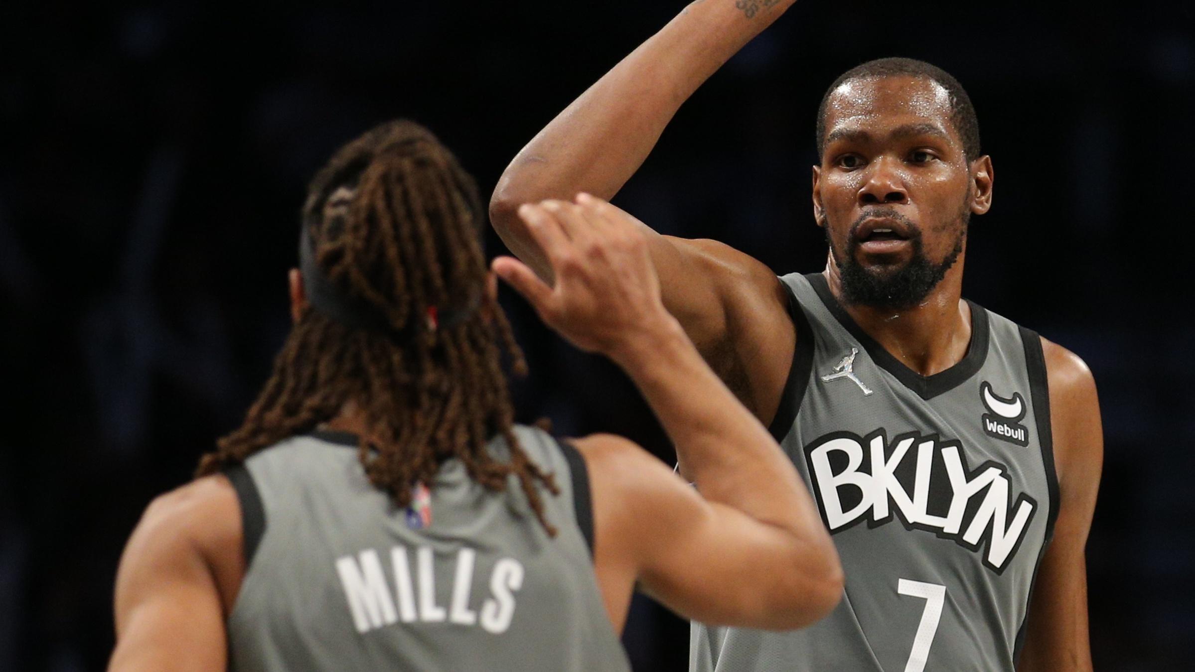 Oct 25, 2021; Brooklyn, New York, USA; Brooklyn Nets guard Patty Mills (8) high fives forward Kevin Durant (7) after a three point shot during the third quarter at Barclays Center. Mandatory Credit: Brad Penner-USA TODAY Sports / © Brad Penner-USA TODAY Sports