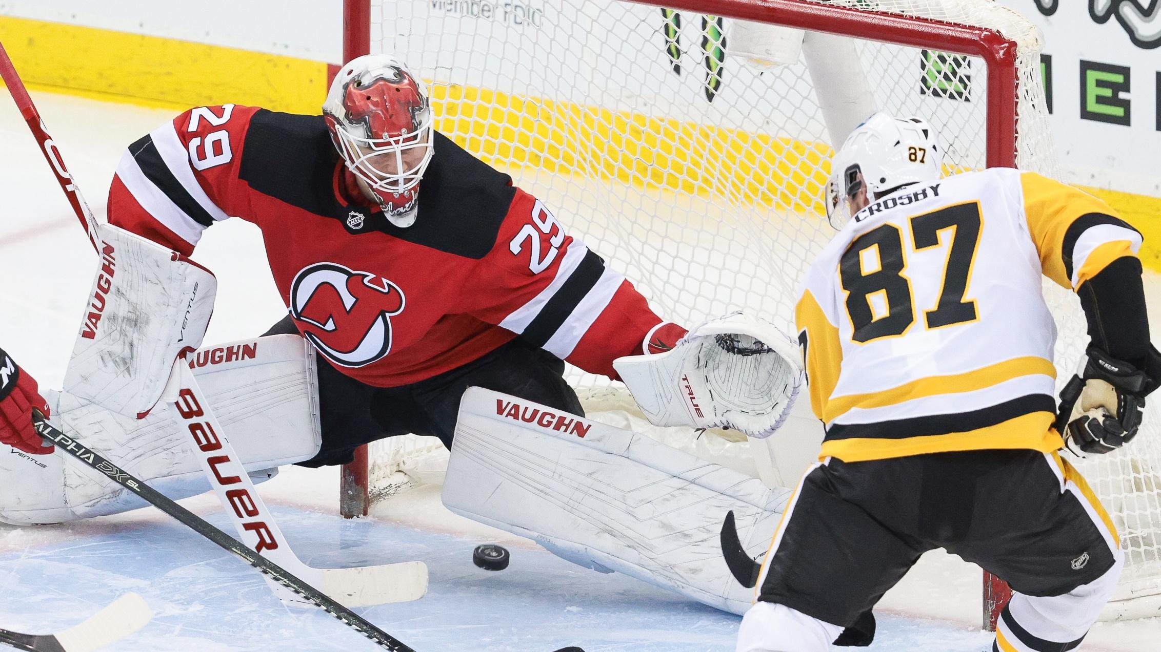 Apr 11, 2021; Newark, New Jersey, USA; New Jersey Devils goaltender Mackenzie Blackwood (29) makes a save on a shot by Pittsburgh Penguins center Sidney Crosby (87) during the third period at Prudential Center. / © Vincent Carchietta-USA TODAY Sports