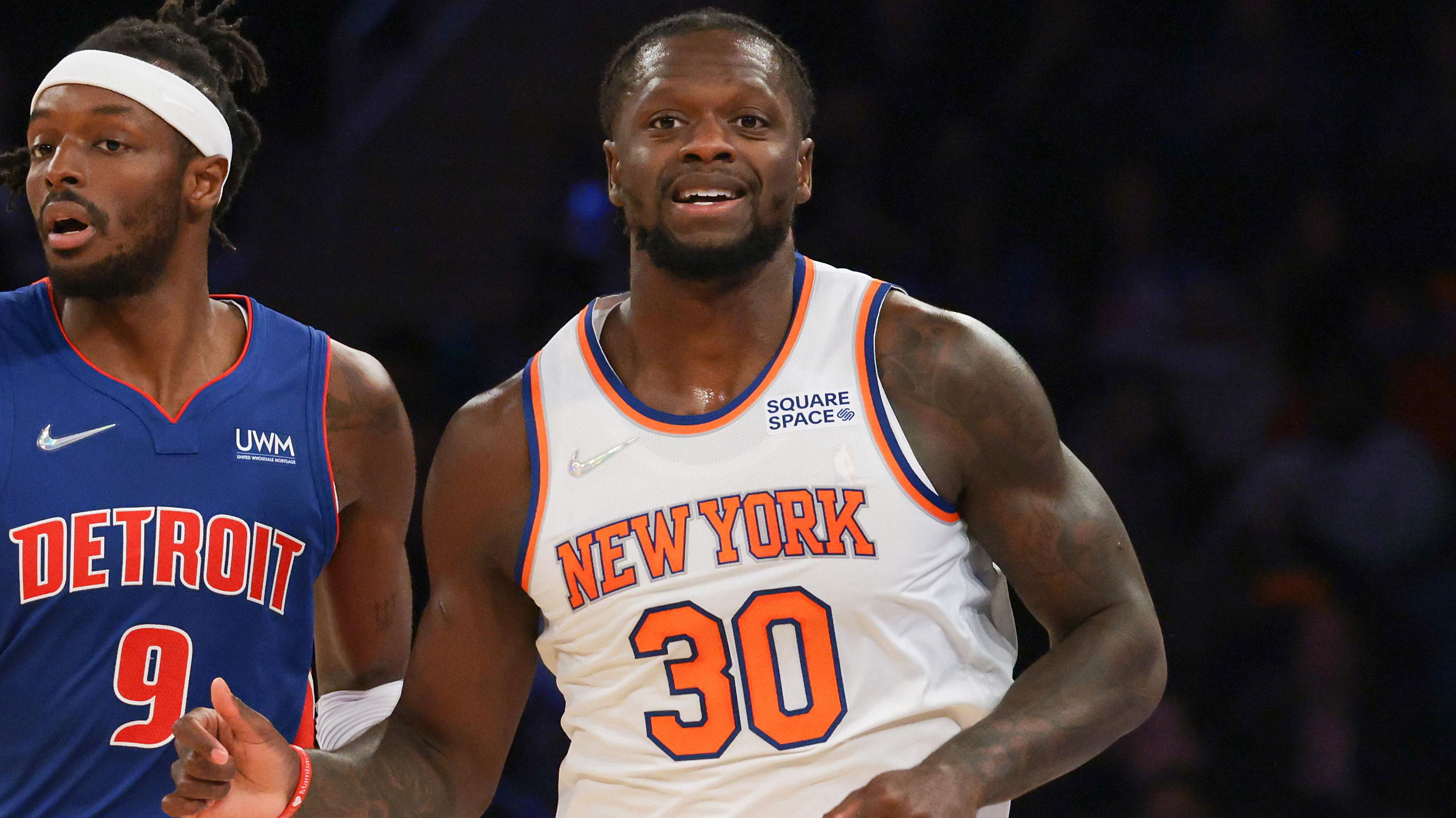 Oct 13, 2021; New York, New York, USA; New York Knicks forward Julius Randle (30) runs up court after scoring a basket alongside Detroit Pistons forward Jerami Grant (9) during the first half at Madison Square Garden. / Vincent Carchietta-USA TODAY Sports