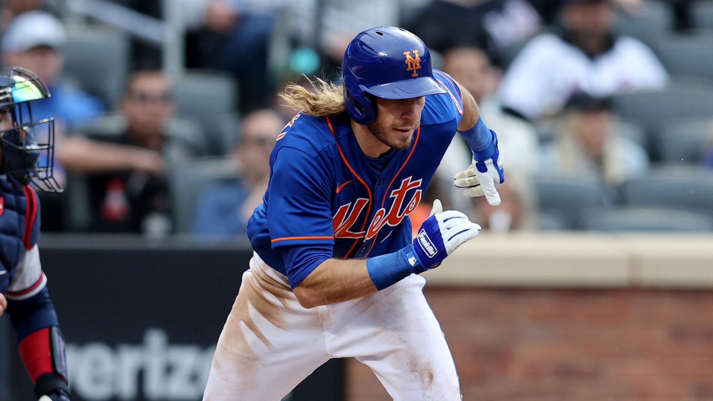 May 3, 2022; New York City, New York, USA; New York Mets center fielder Travis Jankowski (16) runs out an infield single against the Atlanta Braves during the sixth inning at Citi Field. / Brad Penner-USA TODAY Sports