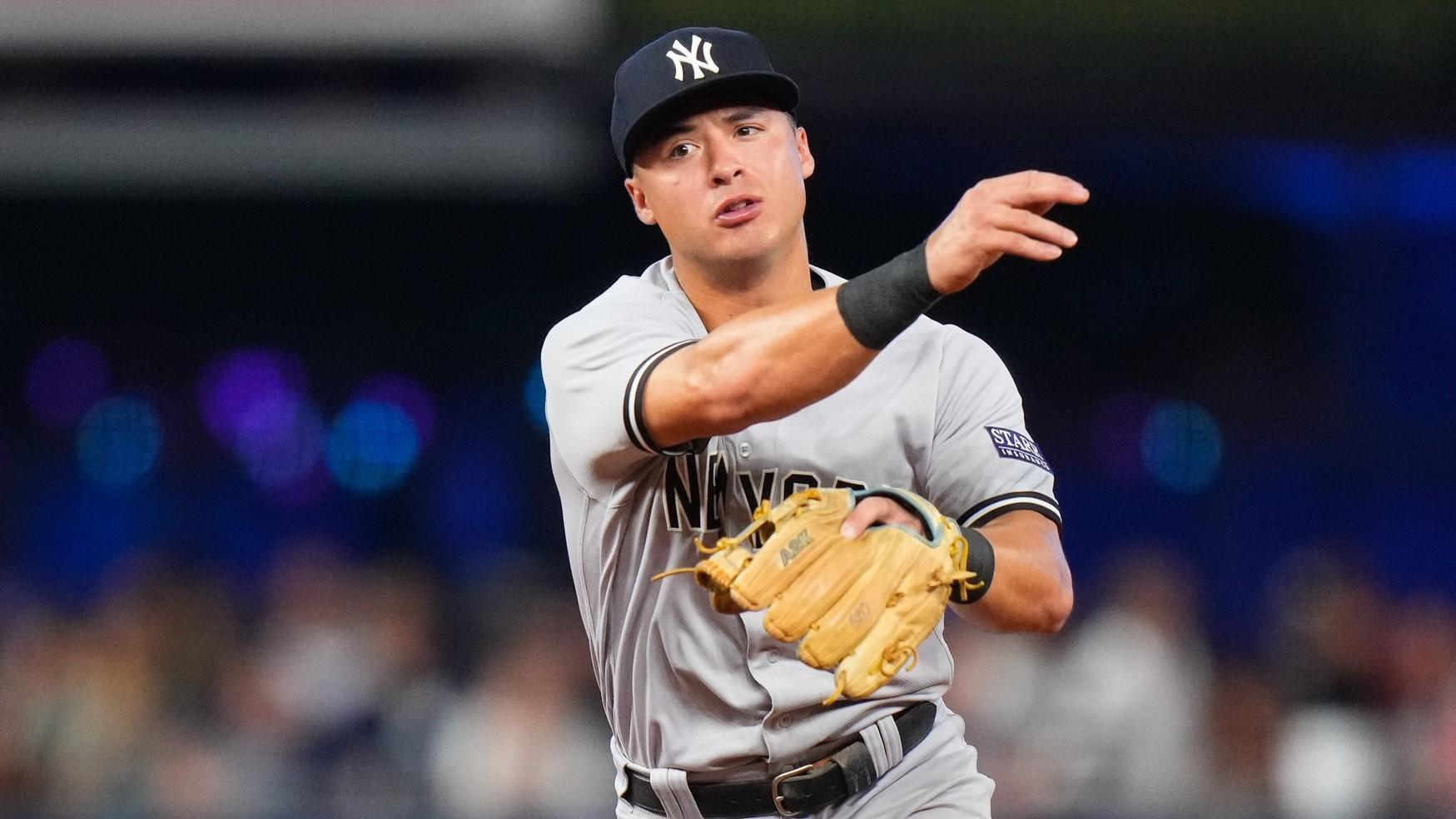Aug 12, 2023; Miami, Florida, USA; New York Yankees shortstop Anthony Volpe (11) throws the ball to first base for an out against the Miami Marlins during the eighth inning at loanDepot Park. / Rich Storry-USA TODAY Sports