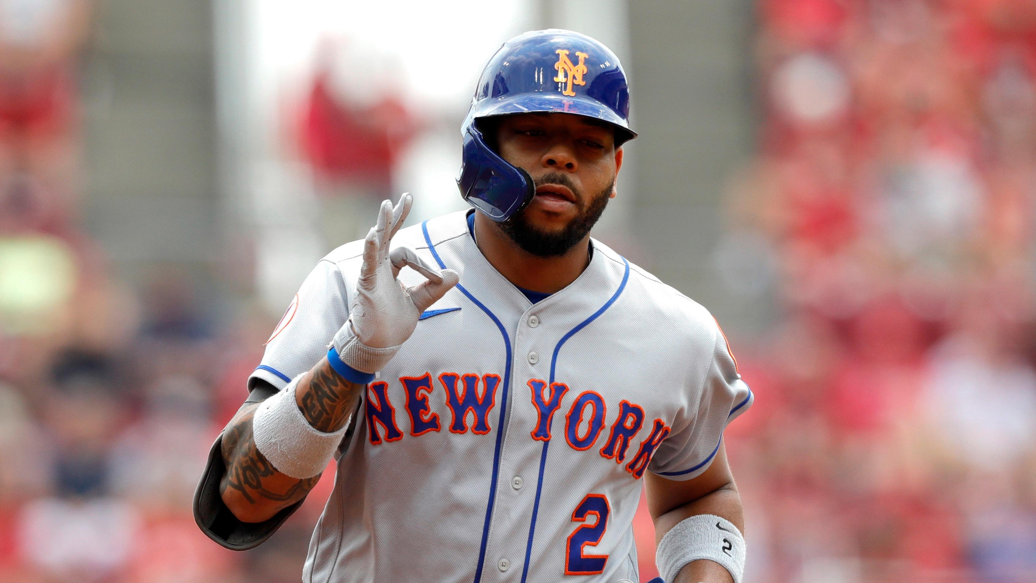 New York Mets left fielder Dominic Smith (2) reacts after hitting a grand slam home run against the Cincinnati Reds in the third inning at Great American Ball Park. / David Kohl - USA TODAY Sports