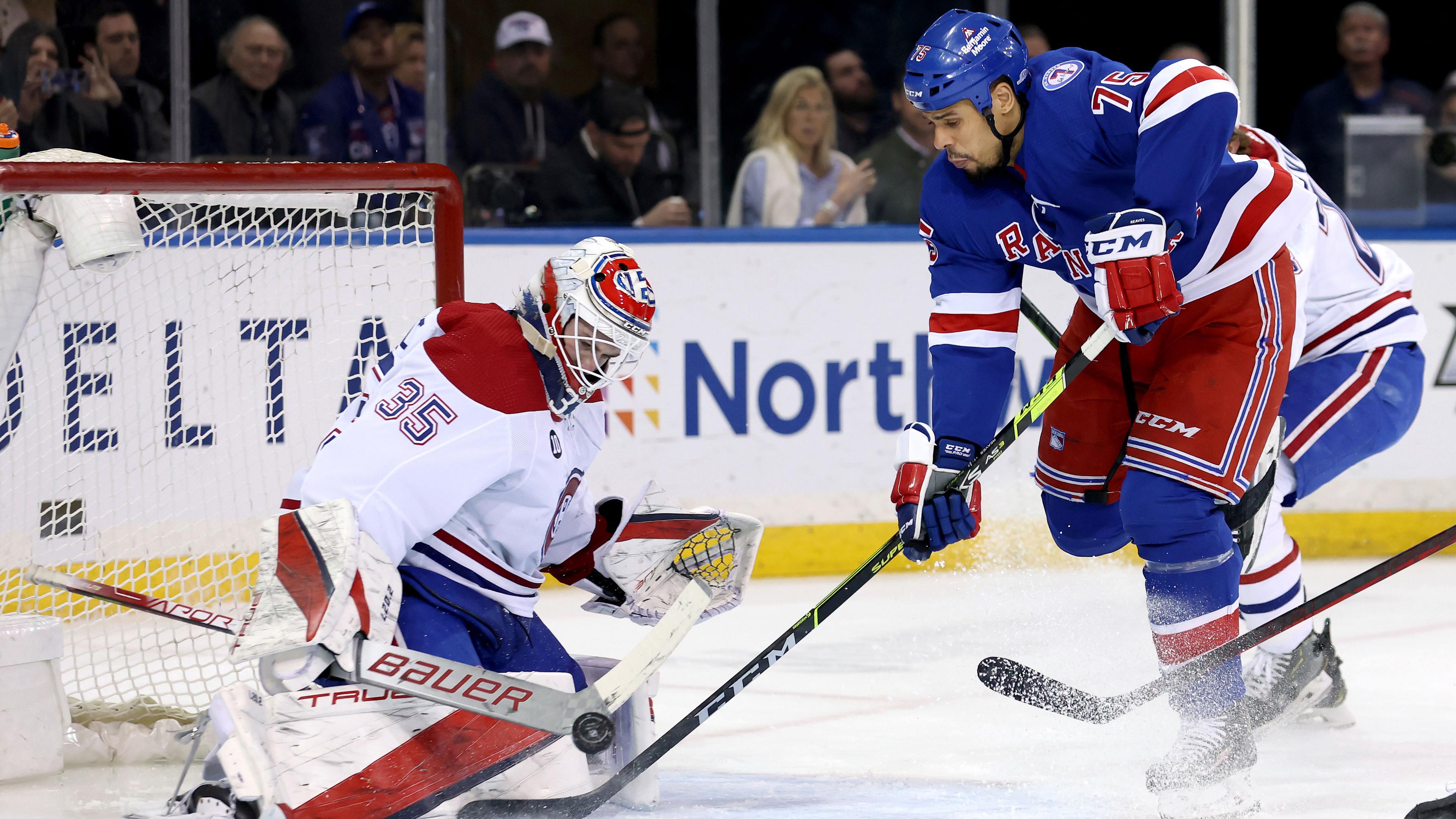 Apr 27, 2022; New York, New York, USA; Montreal Canadiens goaltender Sam Montembeault (35) makes a save against New York Rangers right wing Ryan Reaves (75) during the third period at Madison Square Garden. / Brad Penner-USA TODAY Sports