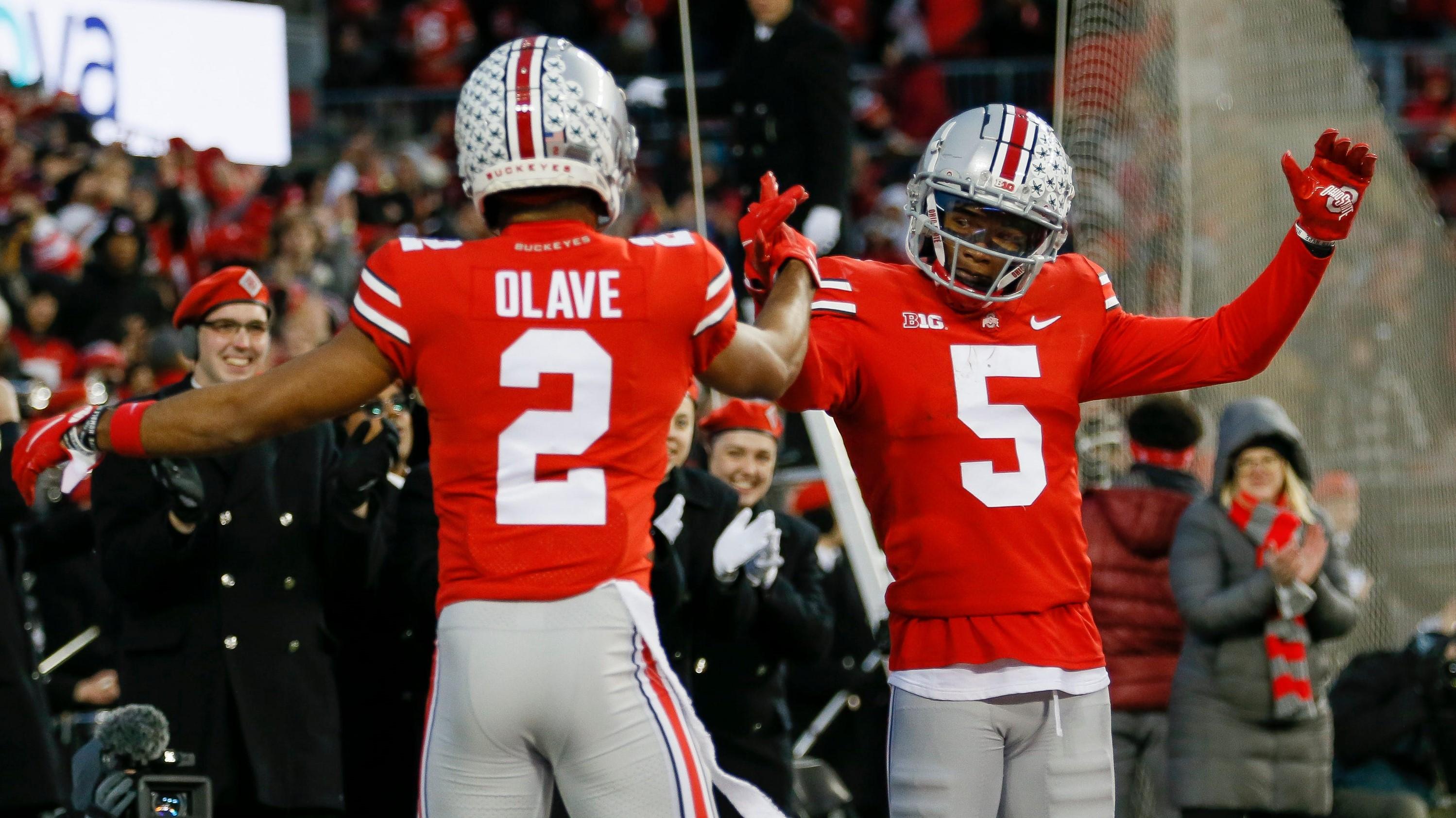 Ohio State Buckeyes wide receiver Garrett Wilson (5) celebrates a 51-yard touchdown with wide receiver Chris Olave (2) during the second quarter of the NCAA football game against the Purdue Boilermakers at Ohio Stadium in Columbus on Saturday, Nov. 13, 2021. / Adam Cairns/Columbus Dispatch / USA TODAY NETWORK