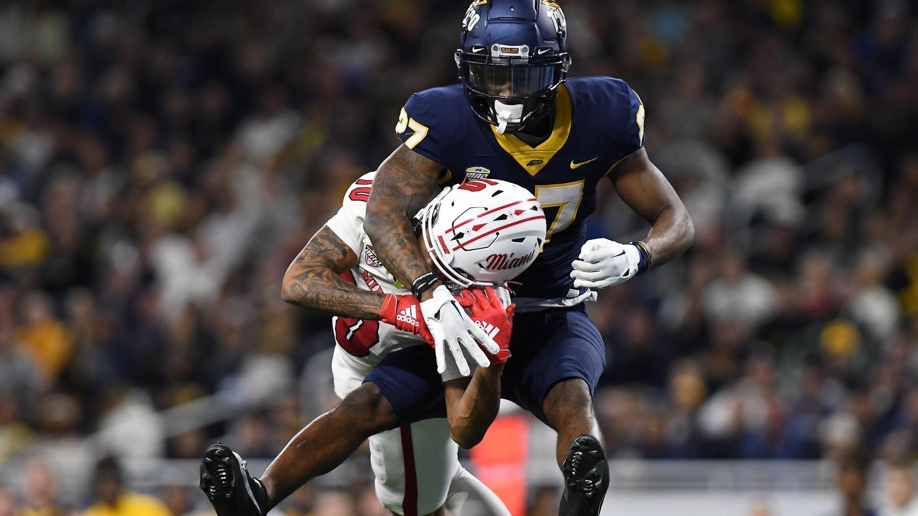 Dec 2, 2023; Detroit, MI, USA; Toledo Rockets cornerback Quinyon Mitchell (27) breaks up a pass intended for Miami (OH) Redhawks wide receiver Gage Larvadain (10) in the third quarter at Ford Field. / Lon Horwedel-USA TODAY Sports