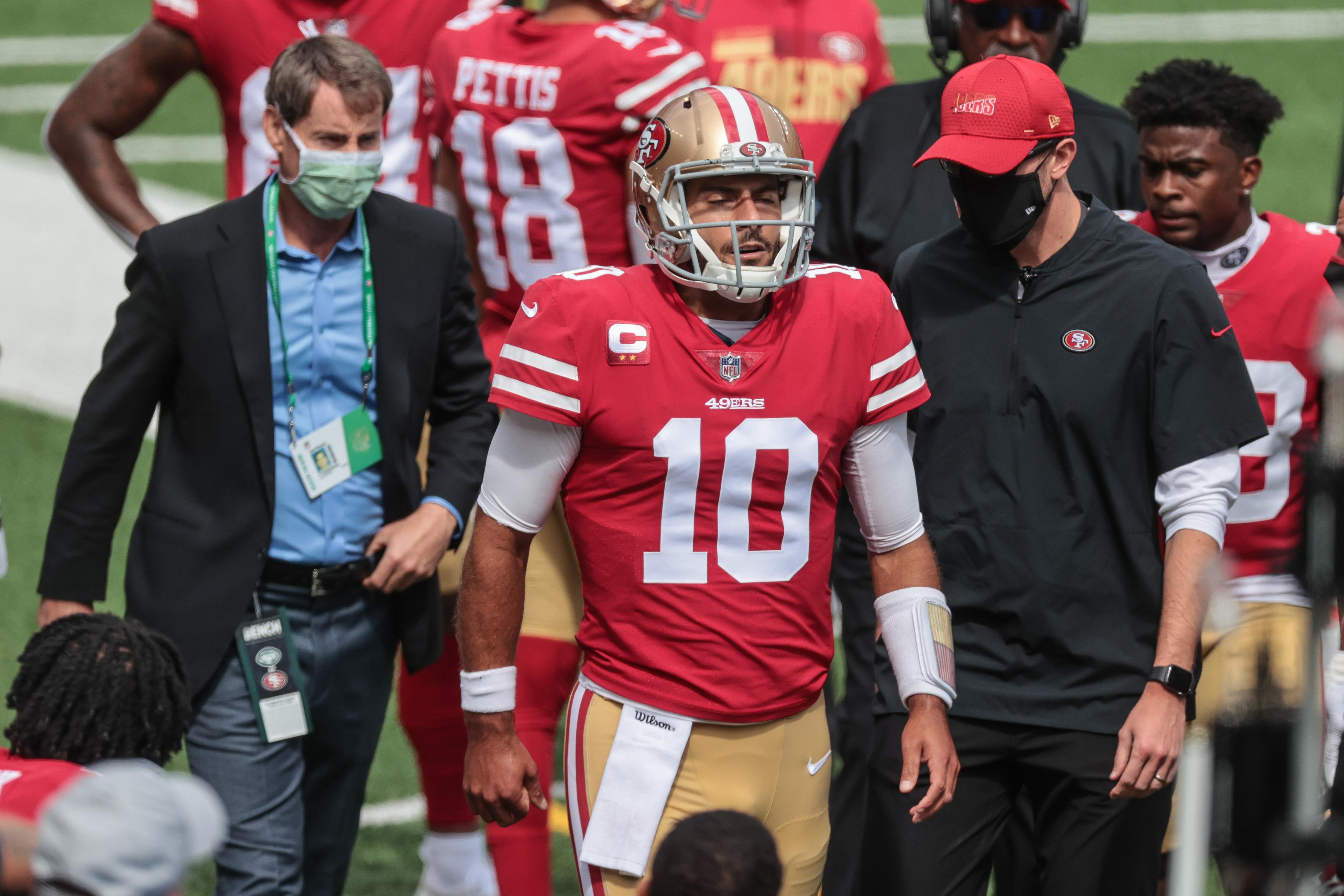 Sep 20, 2020; East Rutherford, New Jersey, USA; San Francisco 49ers quarterback Jimmy Garoppolo (10) reacts while walking on the sidelines after injuring his ankle on the previous play during the first half against the New York Jets at MetLife Stadium. Mandatory Credit: Vincent Carchietta-USA TODAY Sports / © Vincent Carchietta-USA TODAY Sports