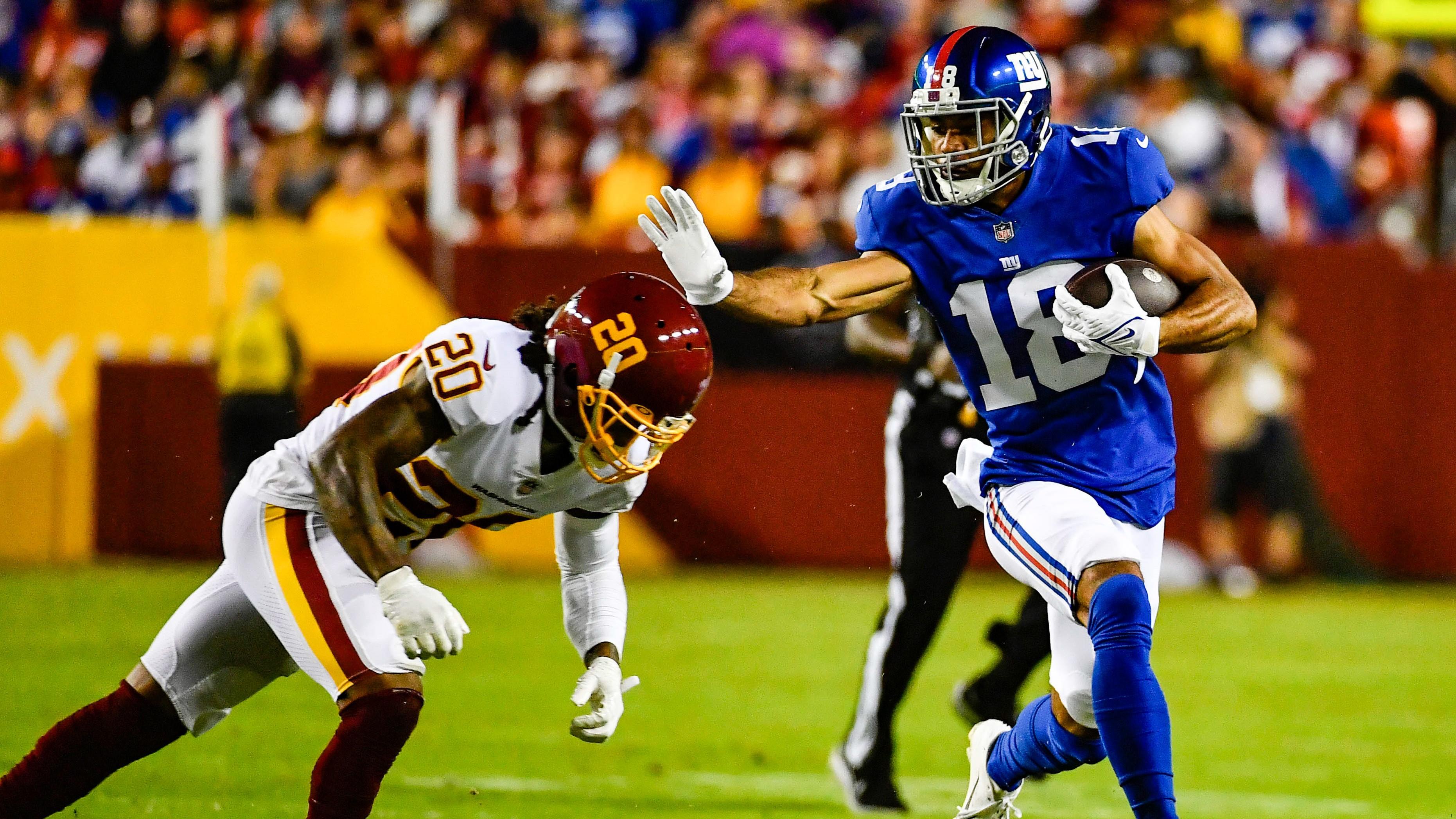New York Giants wide receiver C.J. Board (18) runs after a catch as Washington Football Team cornerback Bobby McCain (20) defends during the first half at FedExField. / Brad Mills - USA TODAY Sports