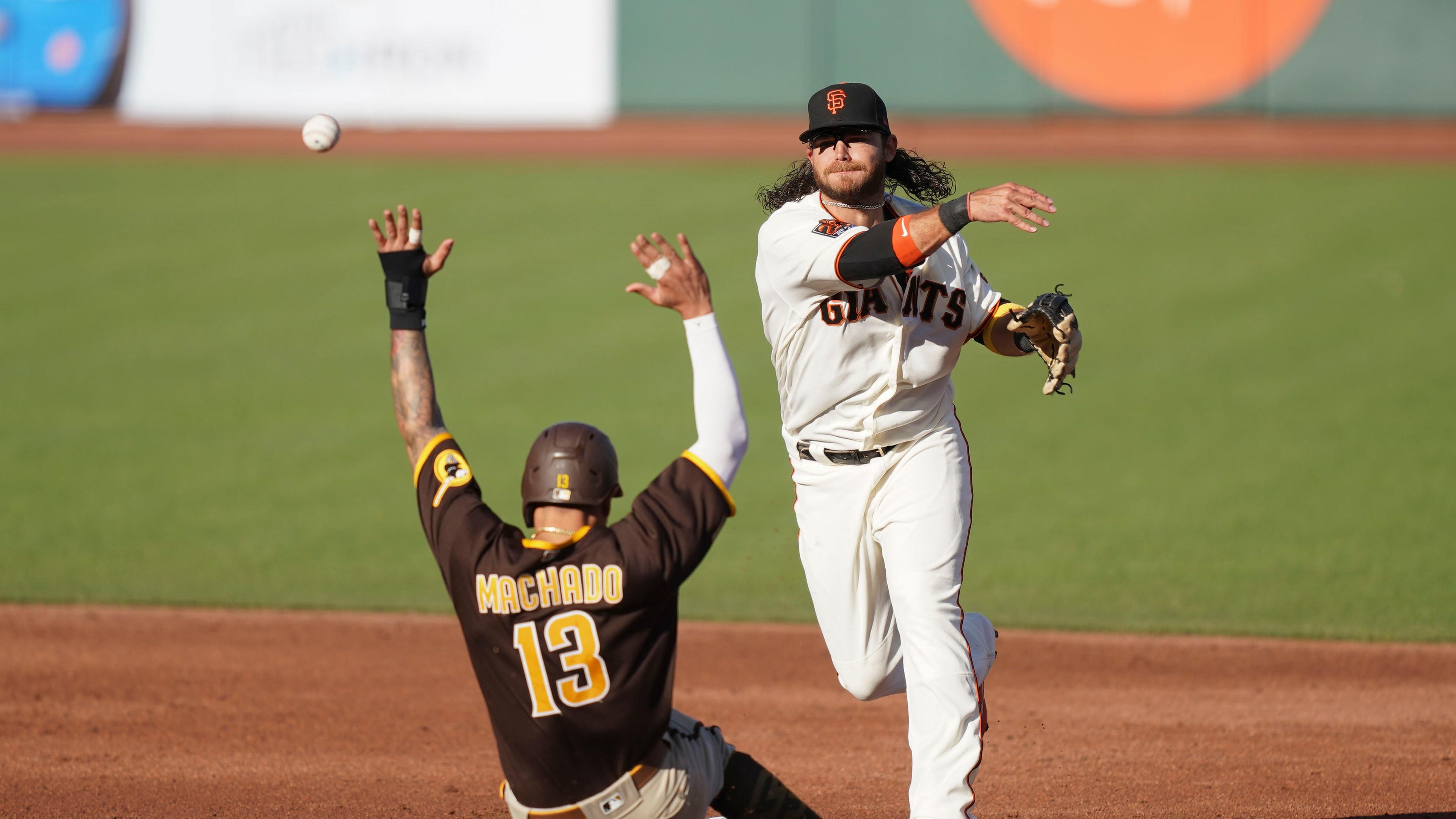 Brandon Crawford looks to turn double play / USA TODAY