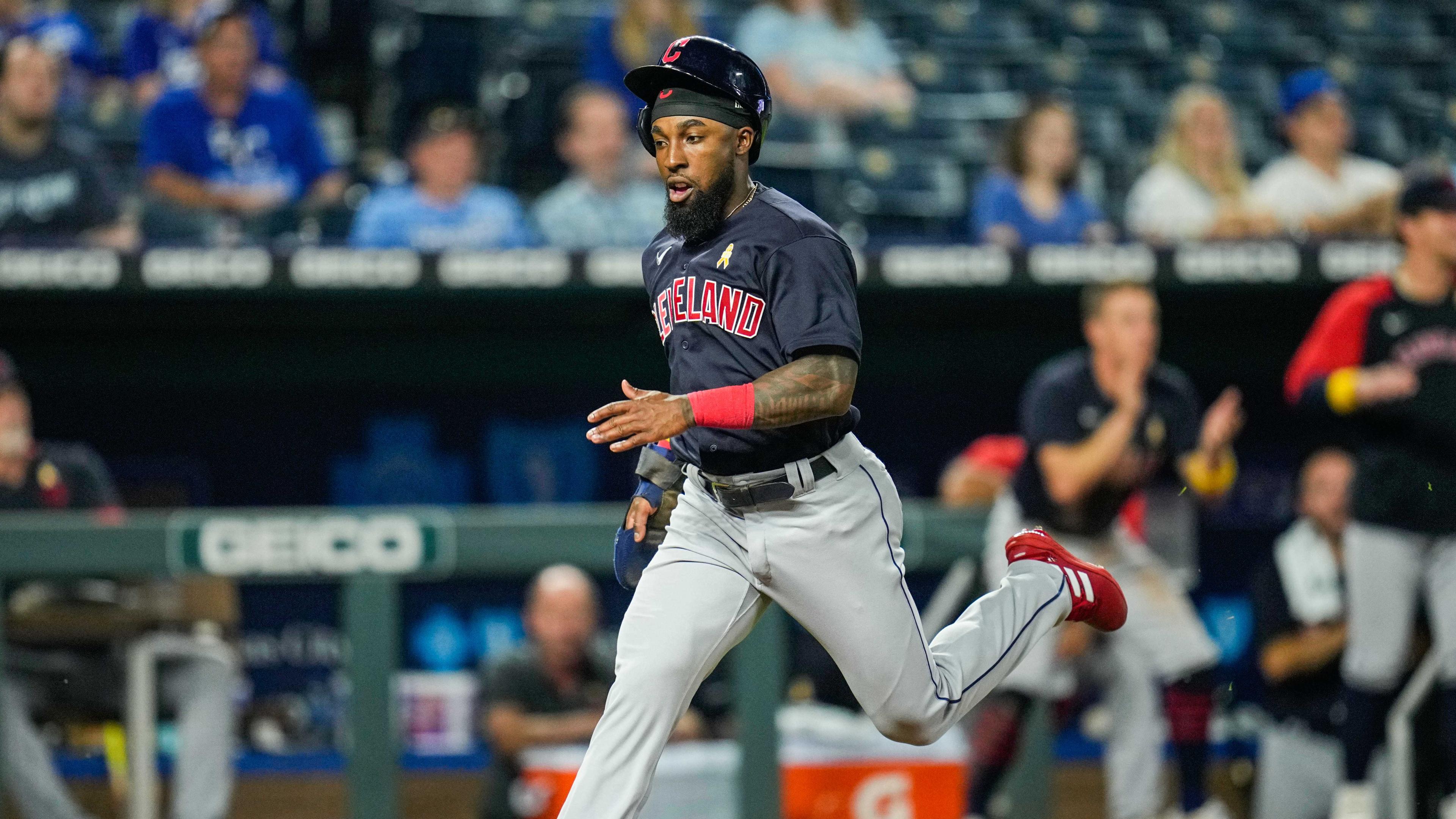 Cleveland Indians right fielder Daniel Johnson (23) scores a run against the Kansas City Royals during the eleventh inning at Kauffman Stadium. / Jay Biggerstaff/USA TODAY
