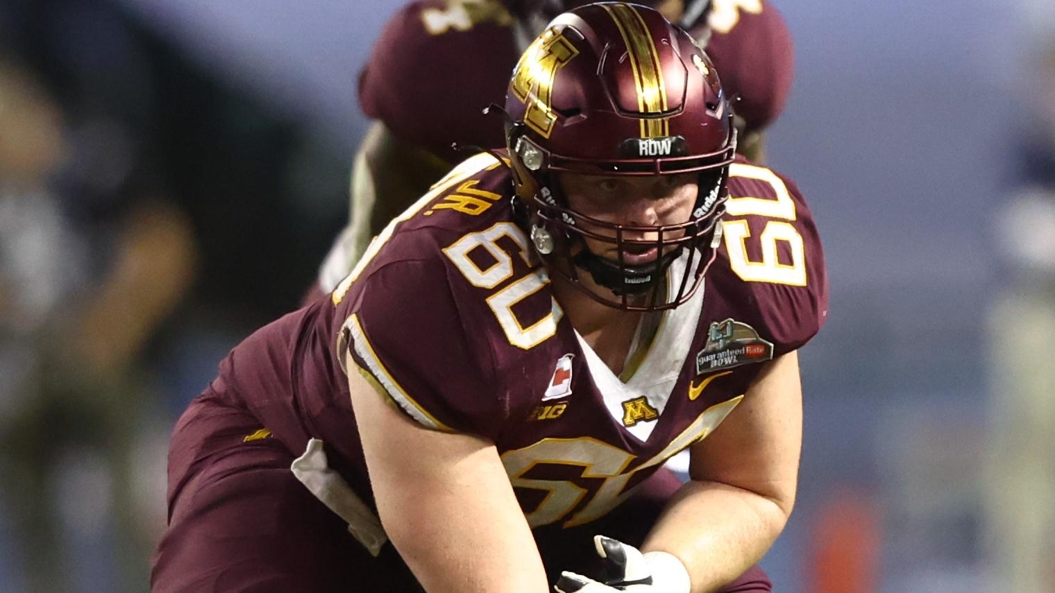 Dec 28, 2021; Phoenix, AZ, USA; Minnesota Golden Gophers center John Michael Schmitz (60) against the West Virginia Mountaineers in the Guaranteed Rate Bowl at Chase Field / Mark J. Rebilas-USA TODAY Sports