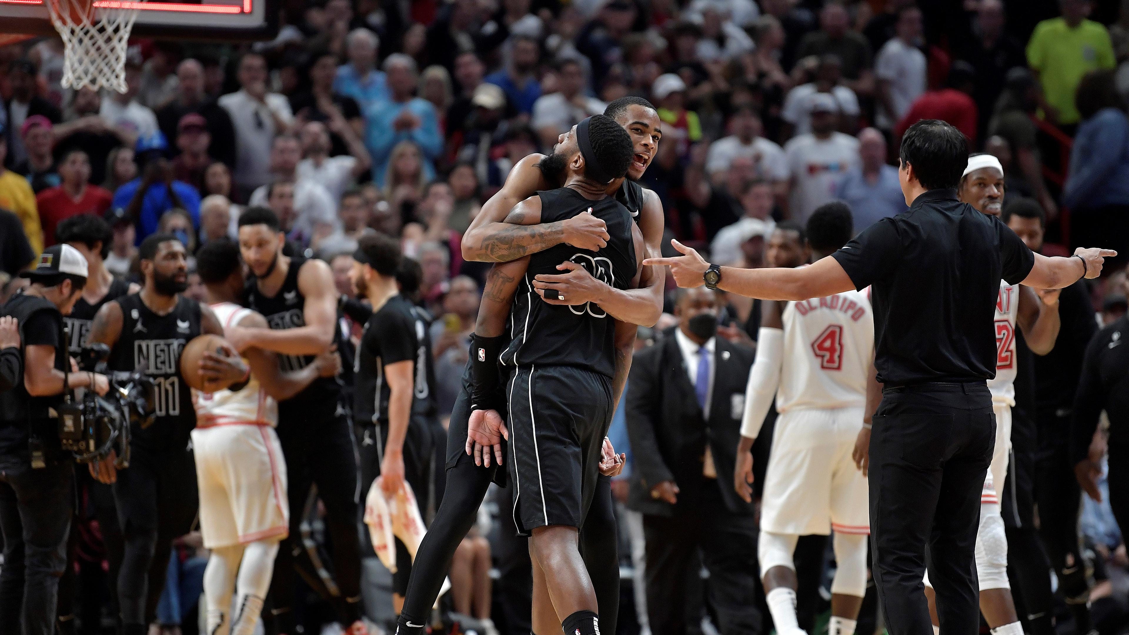 Jan 8, 2023; Miami, Florida, USA; Brooklyn Nets center Nic Claxton (33) hugs forward Royce O'Neale (00) after beating the Miami Heat at FTX Arena. Mandatory Credit: Michael Laughlin-USA TODAY Sports / © Michael Laughlin-USA TODAY Sports