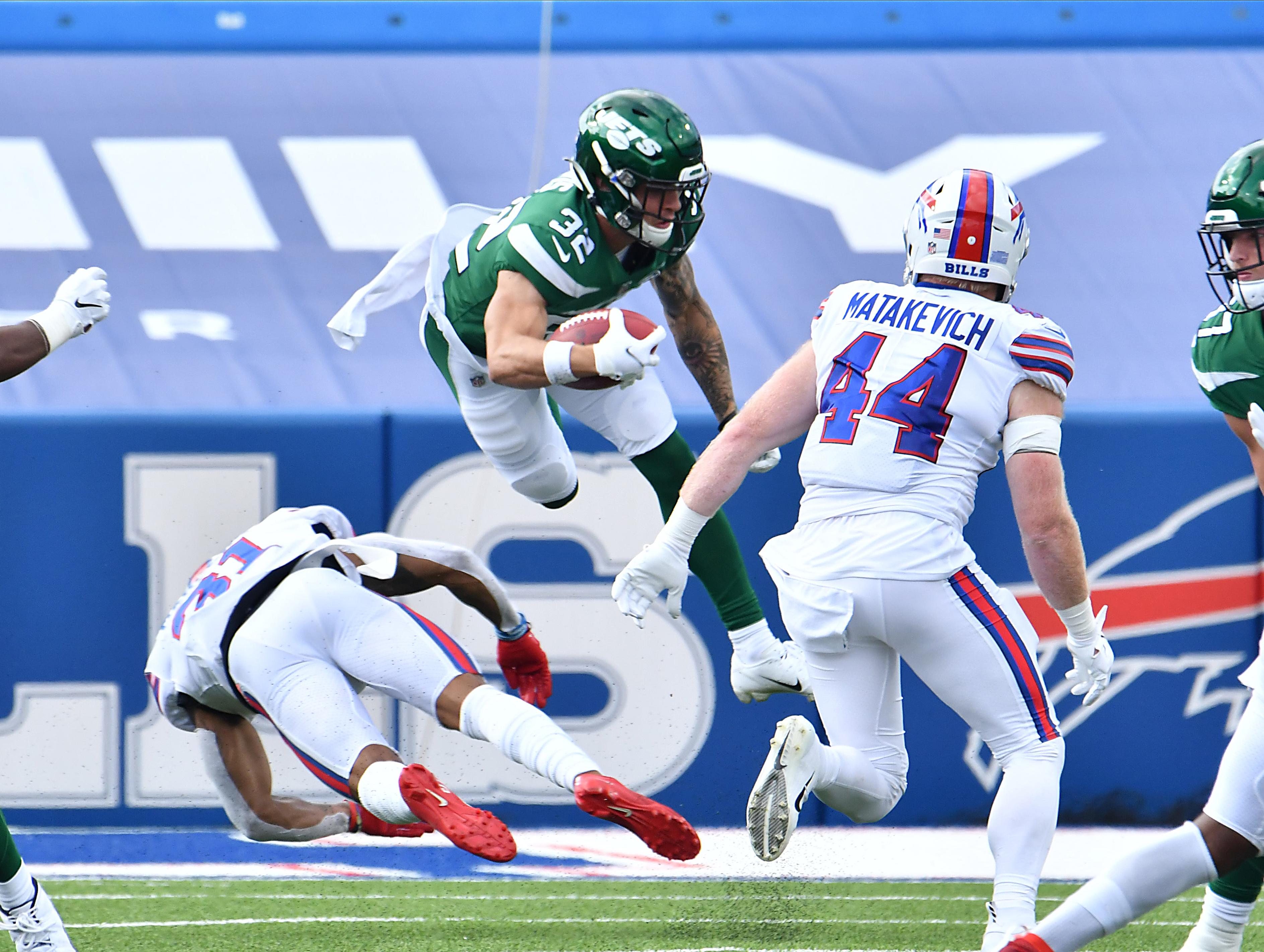 Sep 13, 2020; Orchard Park, New York, USA; New York Jets safety Ashtyn Davis (32) is upended by Buffalo Bills strong safety Dean Marlowe (31) on a kickoff return in the fourth quarter at Bills Stadium. Mandatory Credit: Mark Konezny-USA TODAY Sports / Mark Konezny-USA TODAY Sports