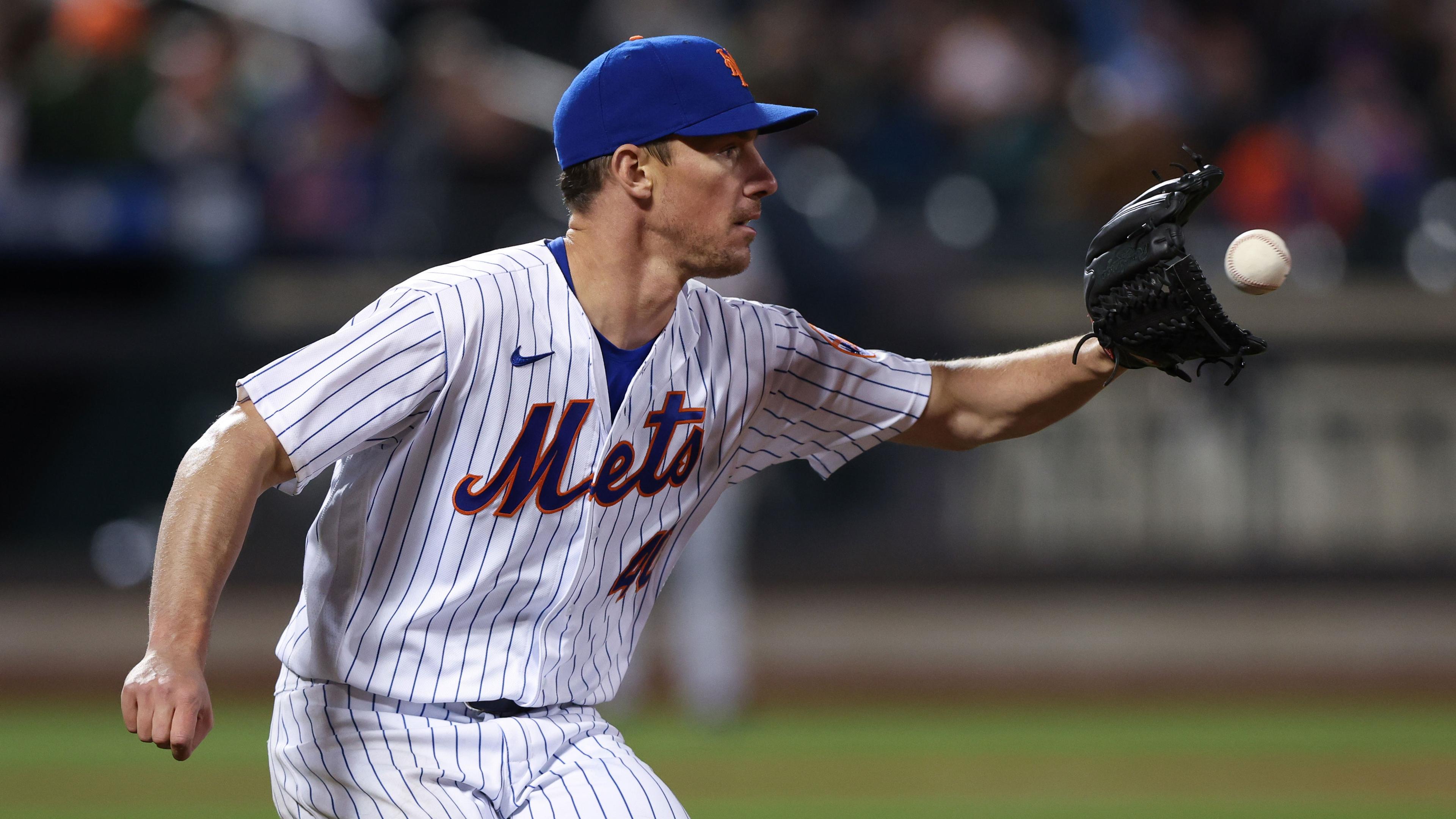 Apr 20, 2022; New York City, New York, USA; New York Mets starting pitcher Chris Bassitt (40) catches the ball for an out at first base during the fourth inning against the San Francisco Giants at Citi Field. / Vincent Carchietta-USA TODAY Sports