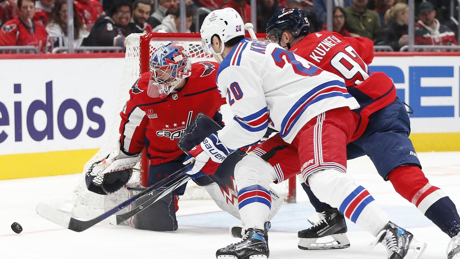 Washington Capitals goaltender Charlie Lindgren (79) watches the puck in front of New York Rangers left wing Chris Kreider (20) and Capitals center Evgeny Kuznetsov (92) during the second period at Capital One Arena. / Amber Searls-USA TODAY Sports