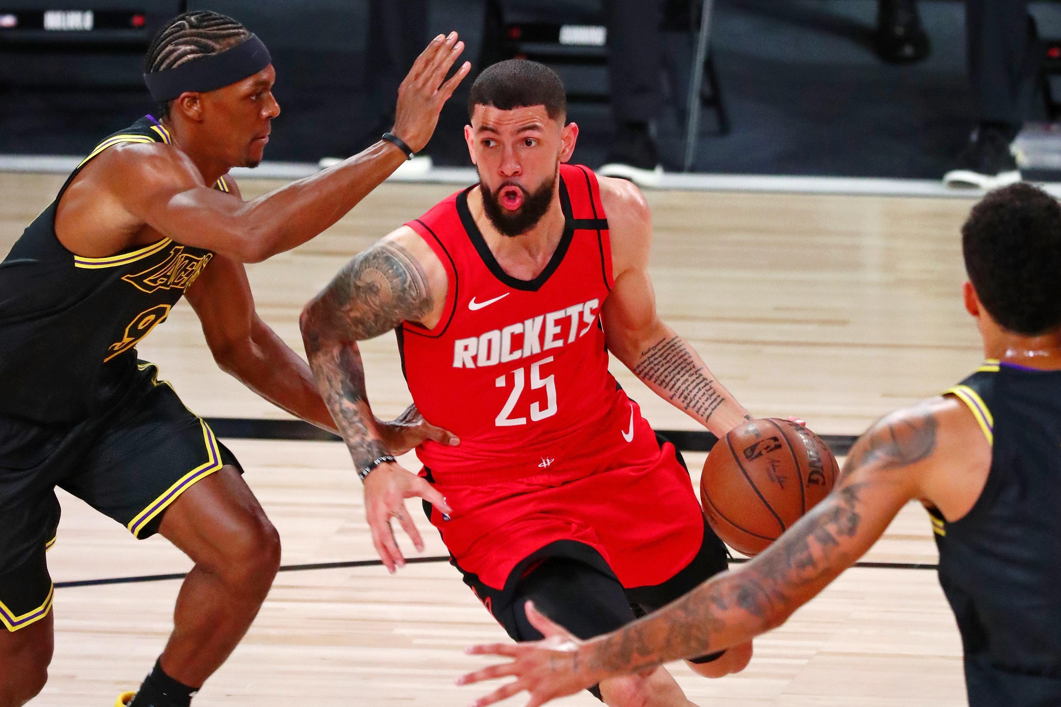 Sep 6, 2020; Lake Buena Vista, Florida, USA; Houston Rockets guard Austin Rivers (25) dribbles against Los Angeles Lakers guard Rajon Rondo (9) during the first half of game two of the second round of the 2020 NBA Playoffs at AdventHealth Arena. Mandatory Credit: Kim Klement-USA TODAY Sports / © Kim Klement-USA TODAY Sports