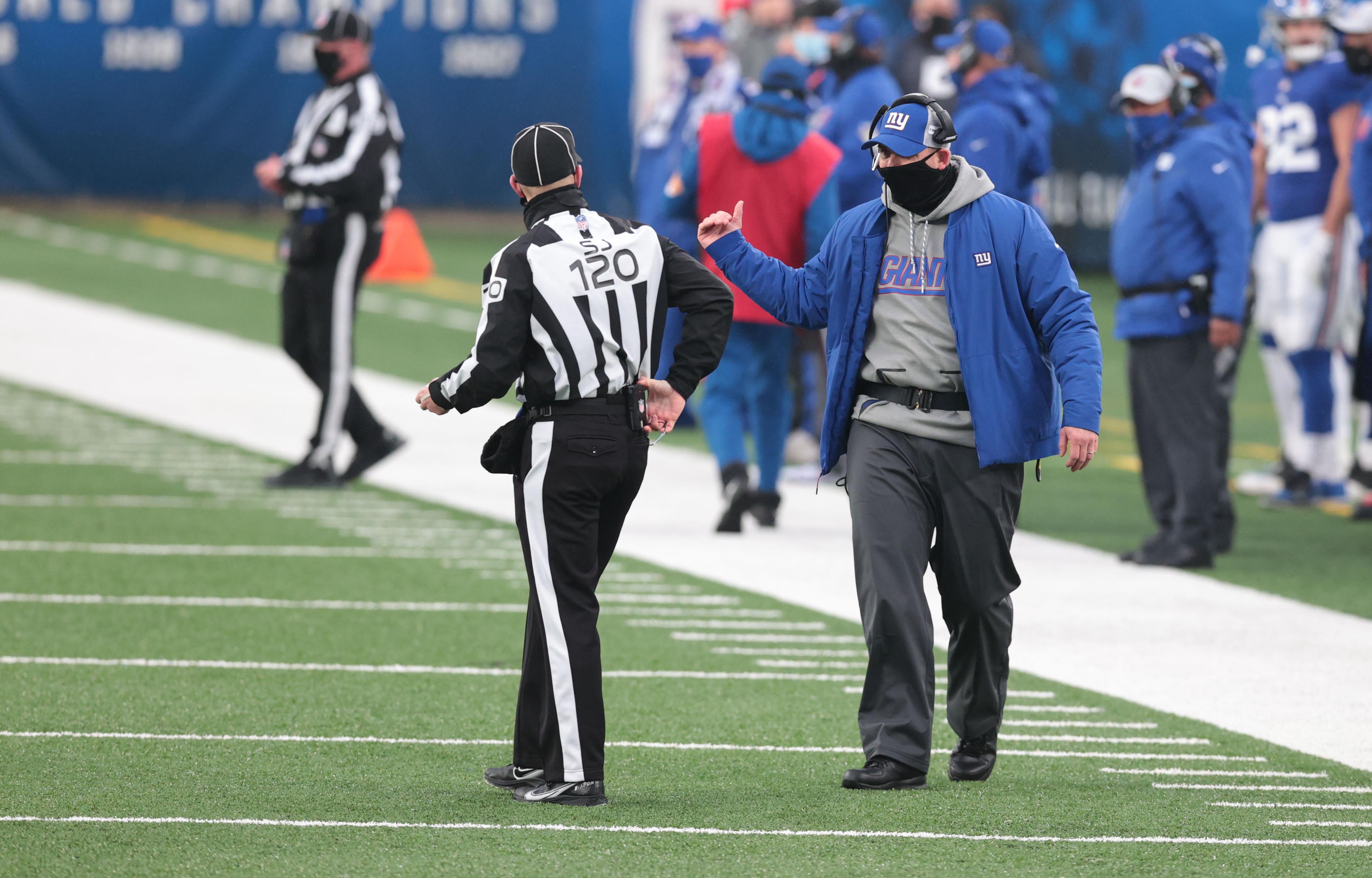 Jan 3, 2021; East Rutherford, NJ, USA; New York Giants head coach Joe Judge talks with the side judge against the Dallas Cowboys in the second half at MetLife Stadium. Mandatory Credit: Vincent Carchietta-USA TODAY Sports / © Vincent Carchietta-USA TODAY Sports