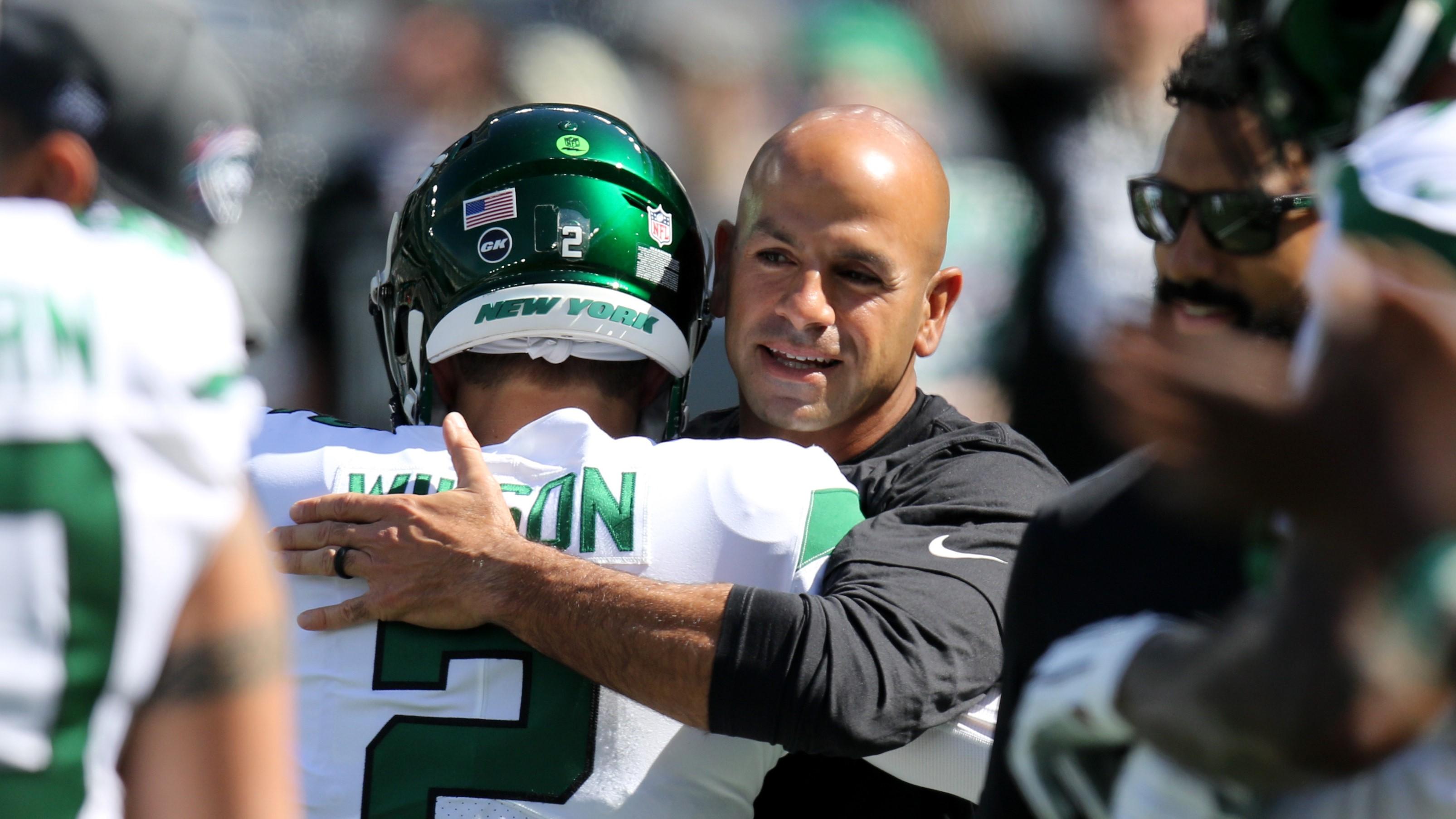 Oct 3, 2021; East Rutherford, NJ, USA; New York Jets head coach Robert Saleh hugs quarterback Zach Wilson before the game against the Tennessee Titans at MetLife Stadium. Mandatory Credit: Kevin R. Wexler-USA TODAY Sports / Kevin R. Wexler-USA TODAY Sports