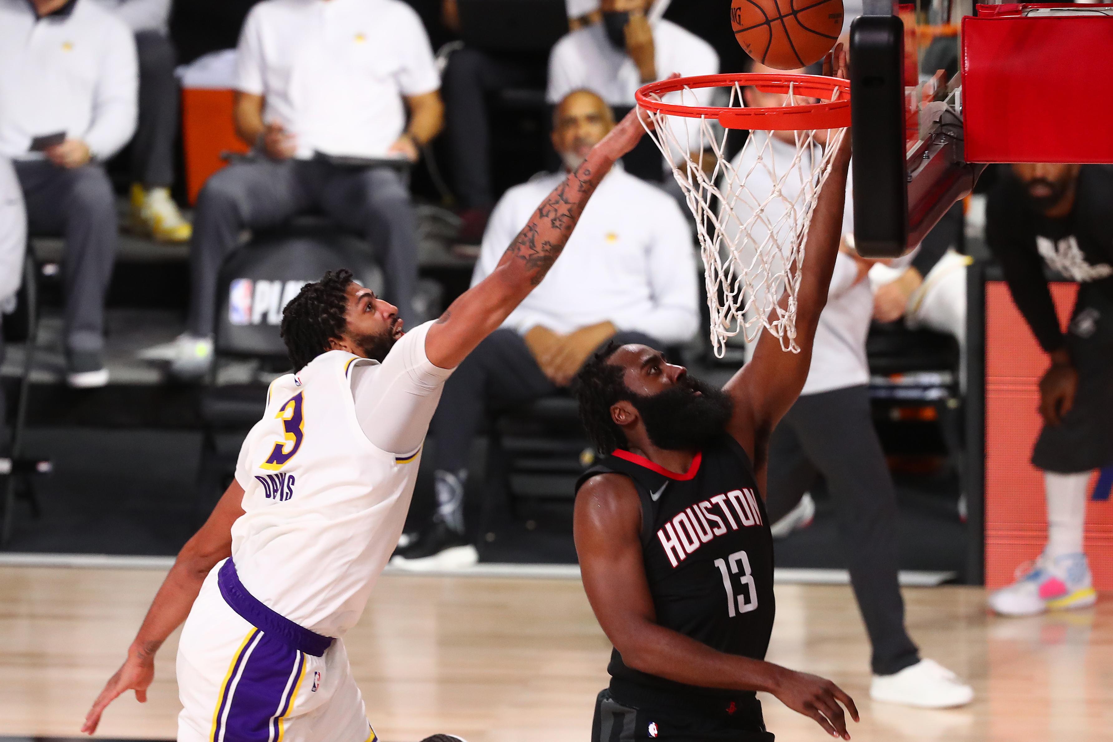 Sep 8, 2020; Lake Buena Vista, Florida, USA; Houston Rockets guard James Harden (13) makes a layup against Los Angeles Lakers forward Anthony Davis (3) during the second half of game three in the second round of the 2020 NBA Playoffs at AdventHealth Arena. / © Kim Klement-USA TODAY Sports