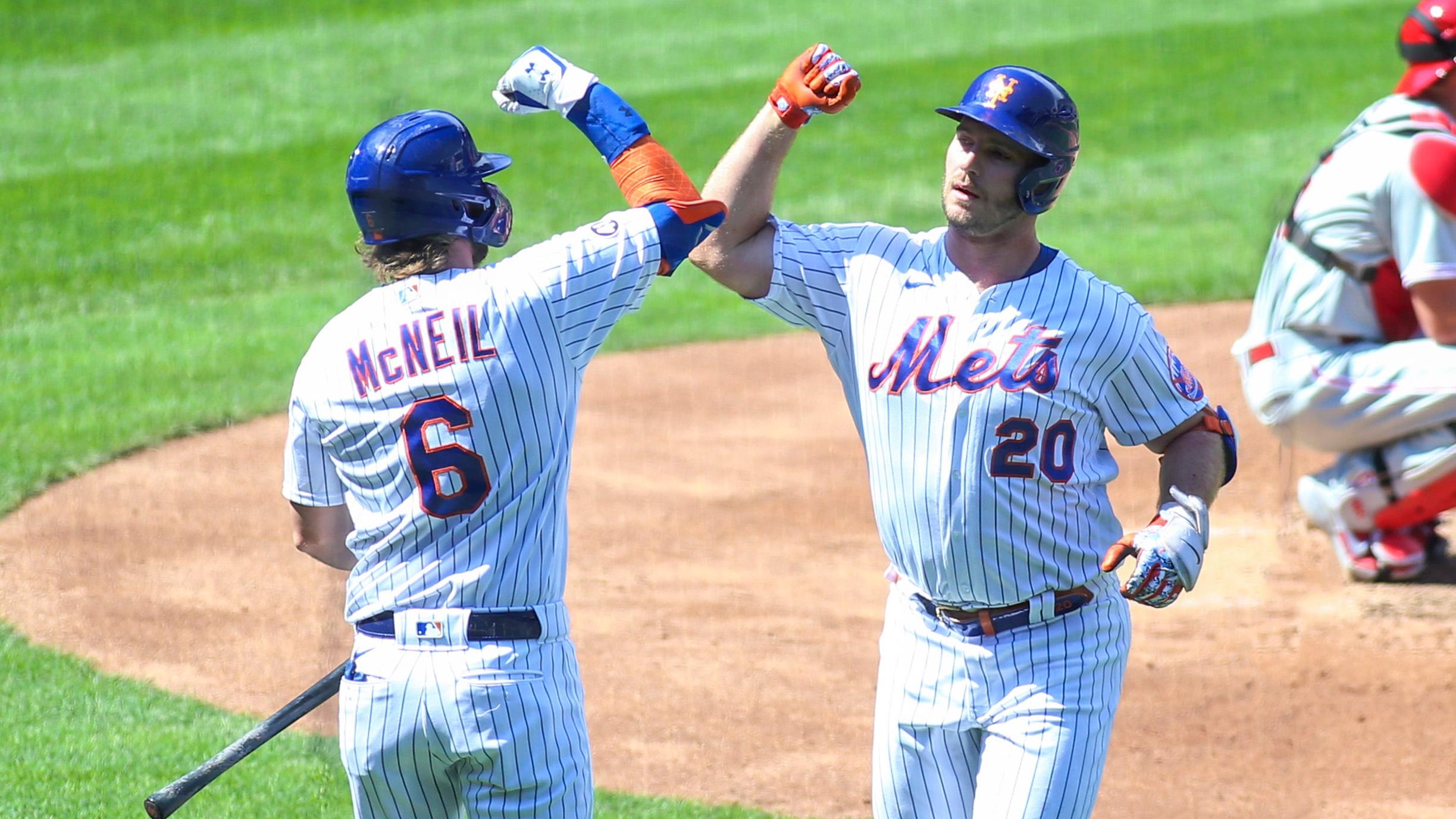 New York Mets designated hitter Pete Alonso (20) is greeted by left fielder Jeff McNeil (6) after hitting a solo home run in the second inning against the Philadelphia Phillies at Citi Field. / USA TODAY Sports