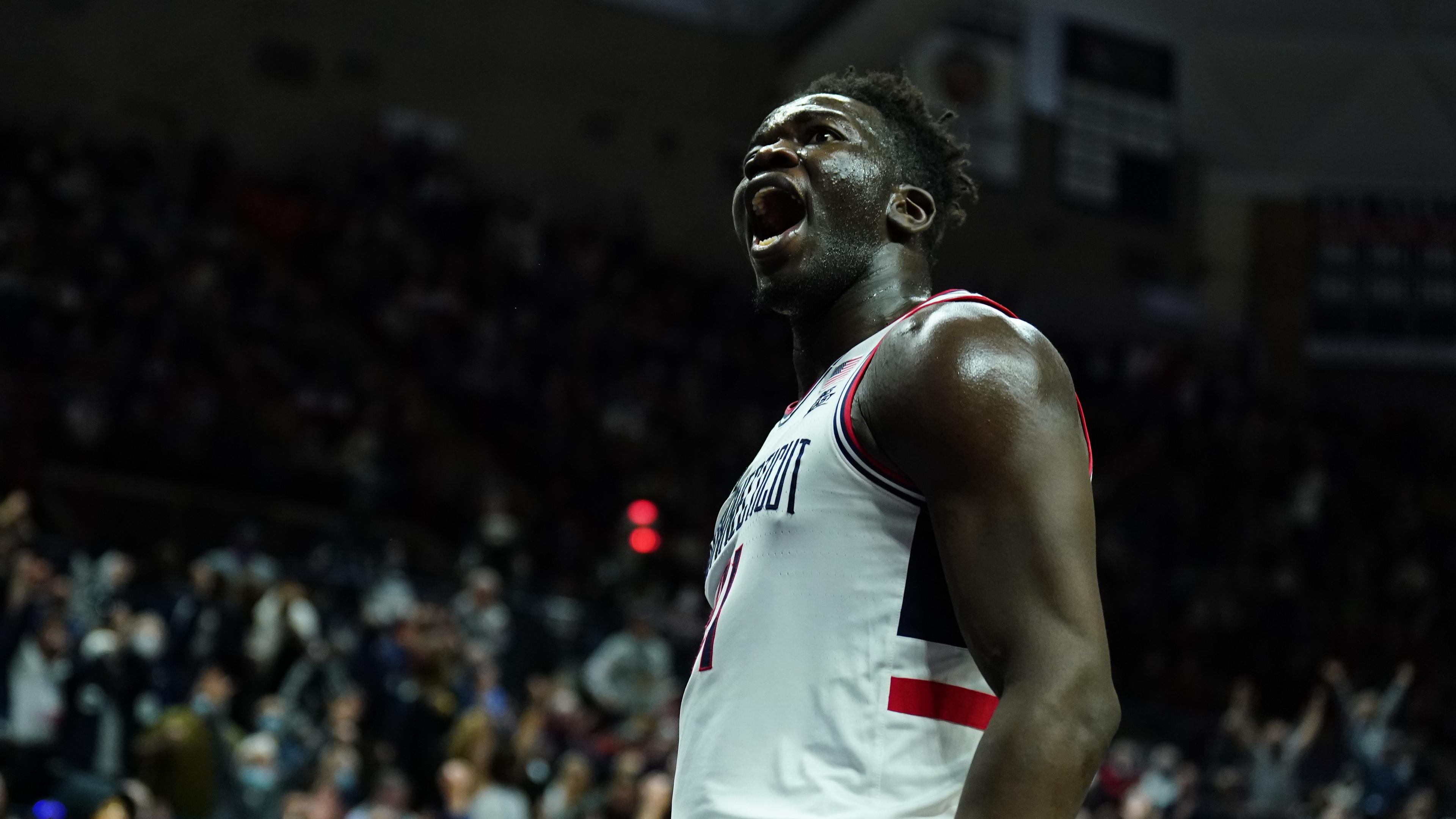 Feb 19, 2022; Storrs, Connecticut, USA; Connecticut Huskies forward Adama Sanogo (21) reacts after his basket against the Xavier Musketeers in the first half at Harry A. Gampel Pavilion. / David Butler II-USA TODAY Sports