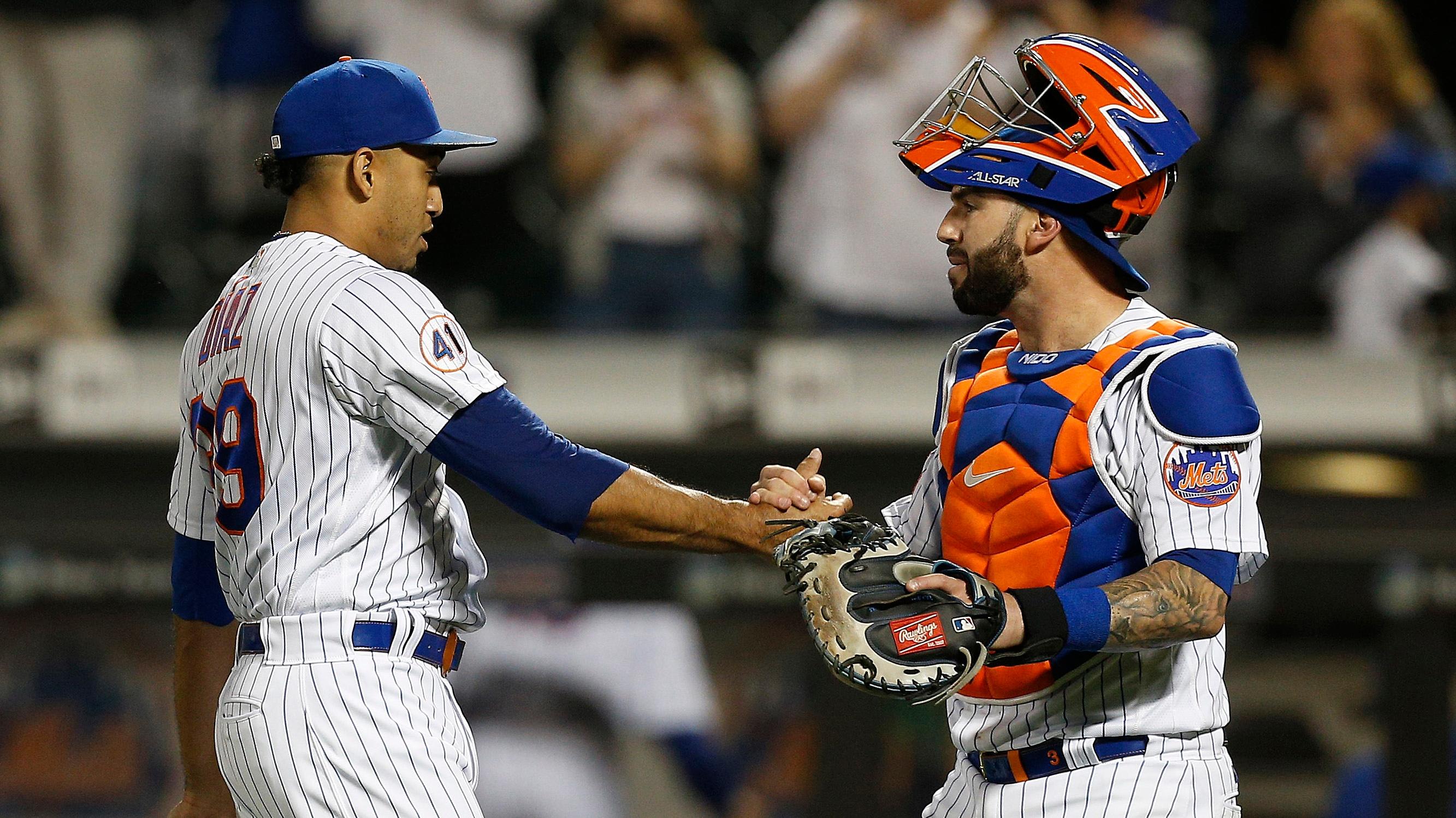May 25, 2021; New York City, New York, USA; New York Mets relief pitcher Edwin Diaz (left) and catcher Tomas Nido (right) celebrate on the field after defeating the Colorado Rockies at Citi Field. / Andy Marlin-USA TODAY Sports