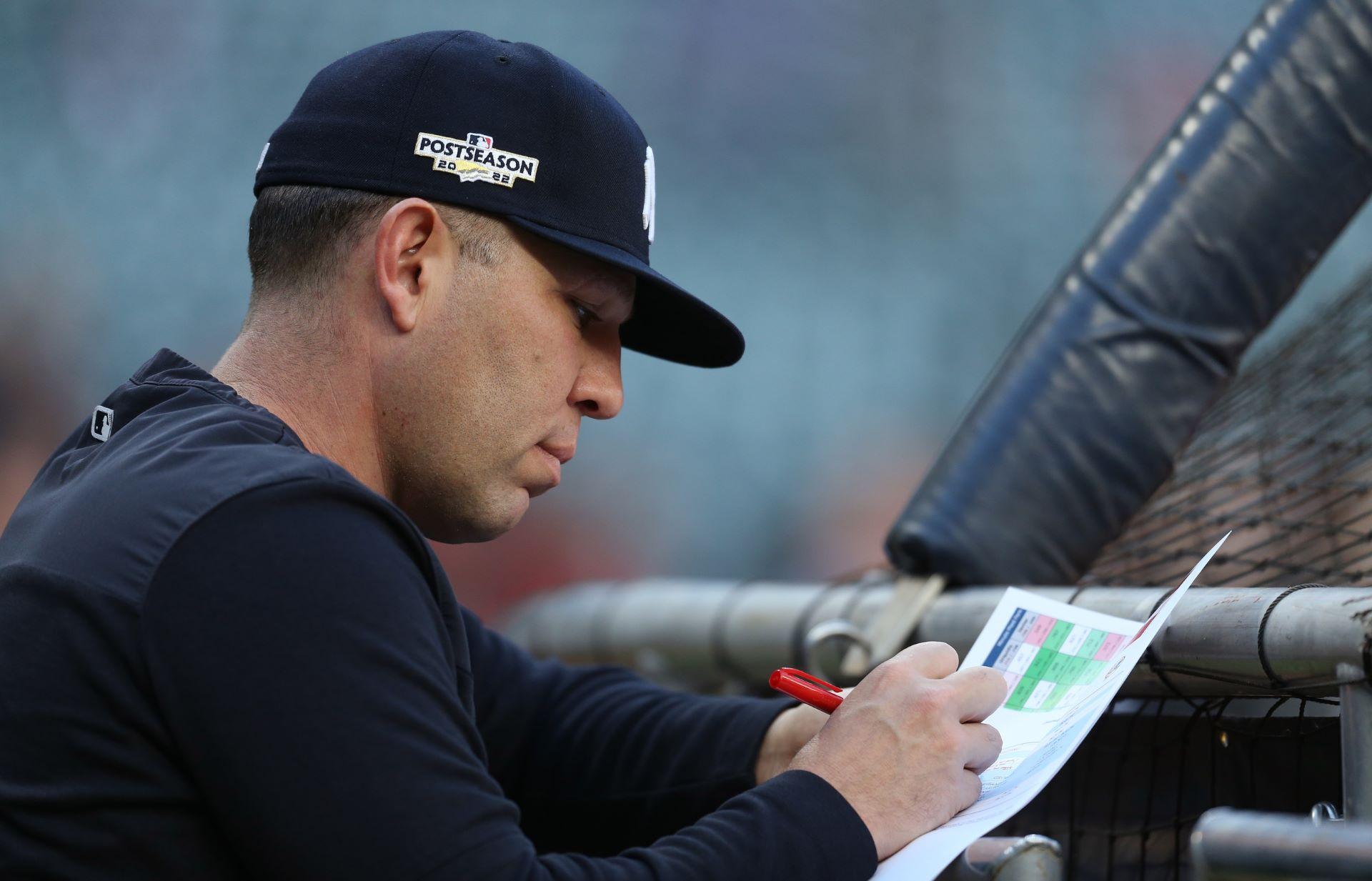 Oct 20, 2022; Houston, Texas, USA; New York Yankees hitting coach Dillon Lawson takes notes before game two of the ALCS against the New York Yankees for the 2022 MLB Playoffs at Minute Maid Park. / Thomas Shea-USA TODAY Sports